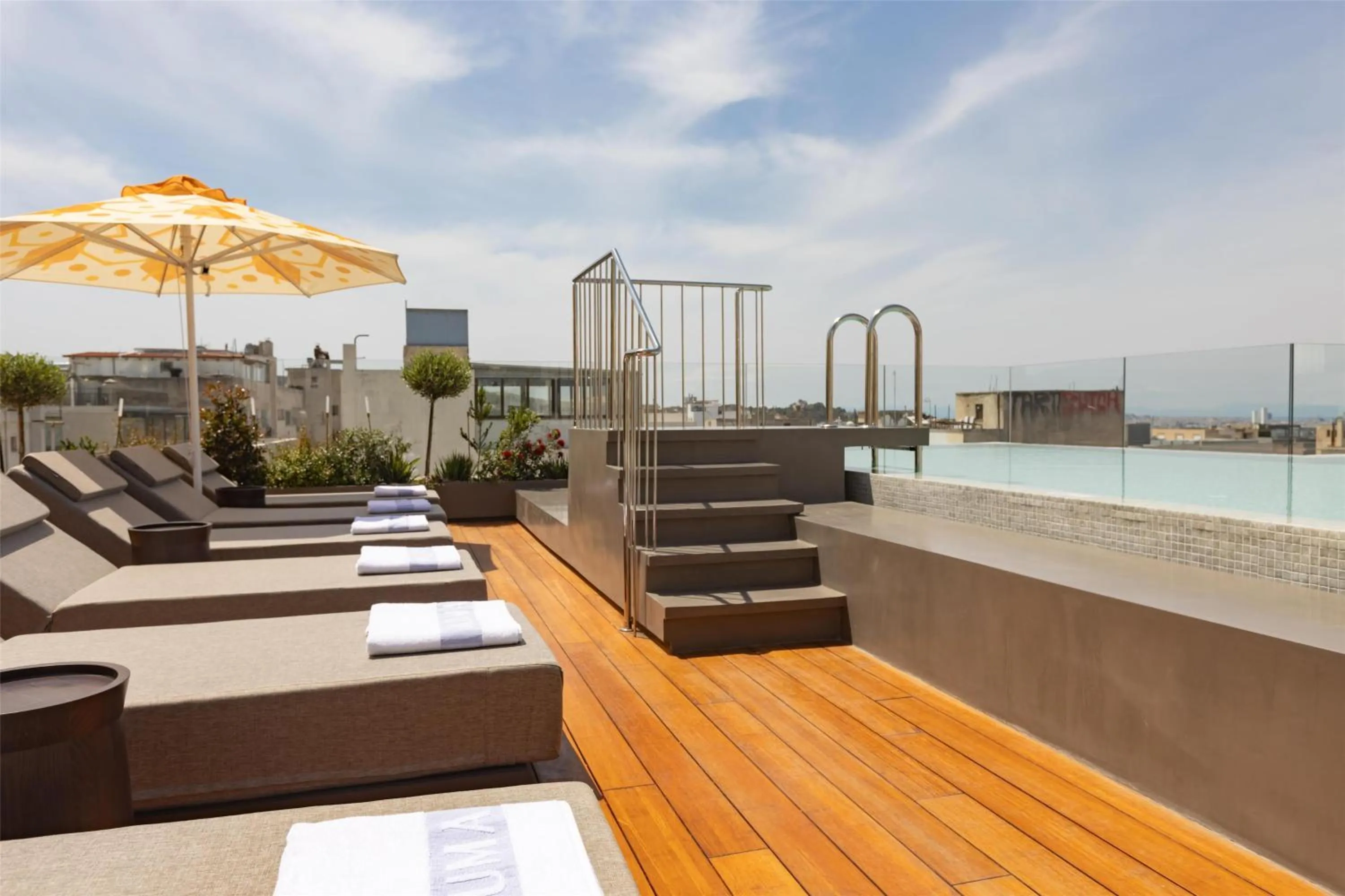 Pool view in Adia Aluma Athens, Curio Collection By Hilton