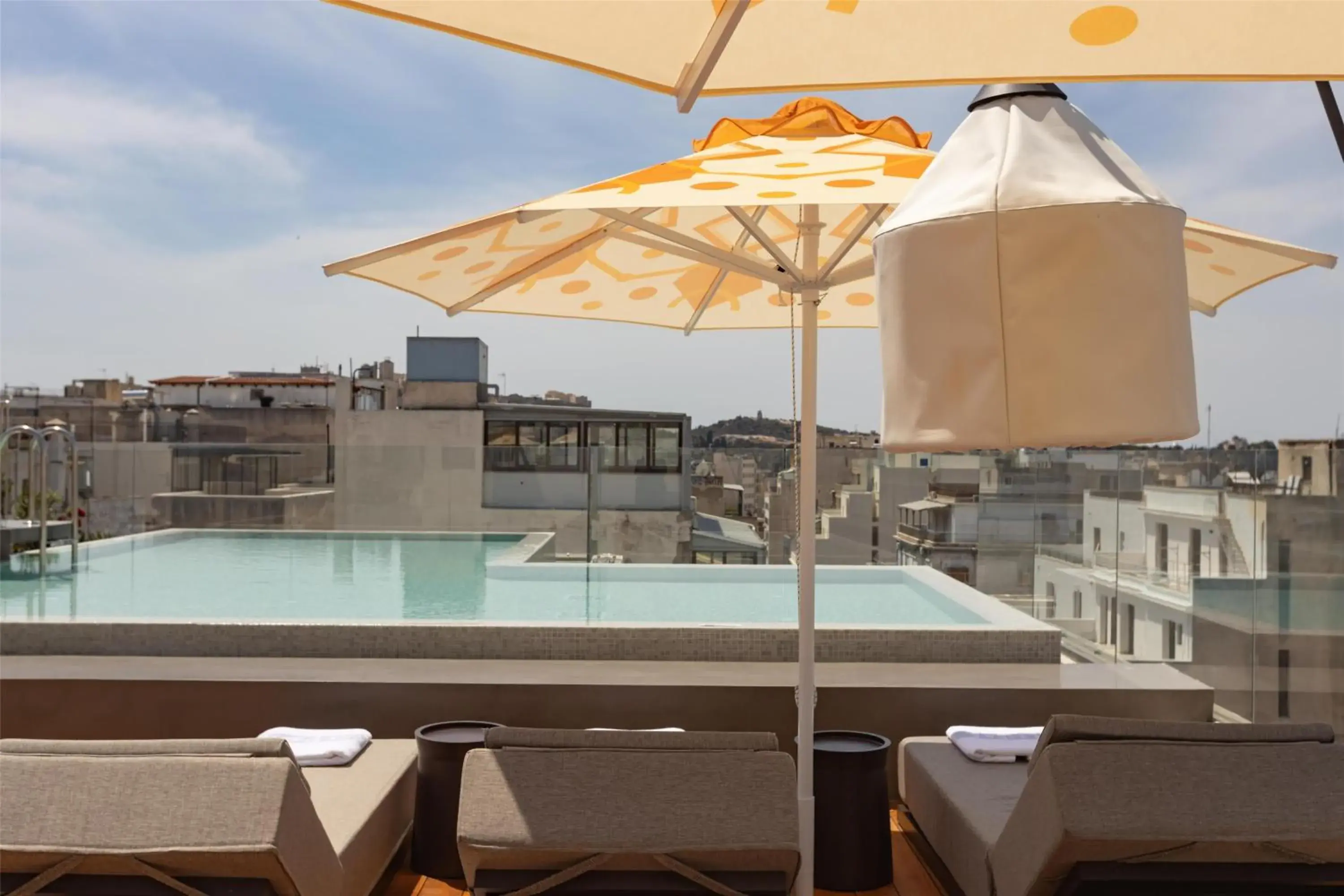 Pool view in Adia Aluma Athens, Curio Collection By Hilton Pool view in Adia Aluma Athens, Curio Collection By Hilton