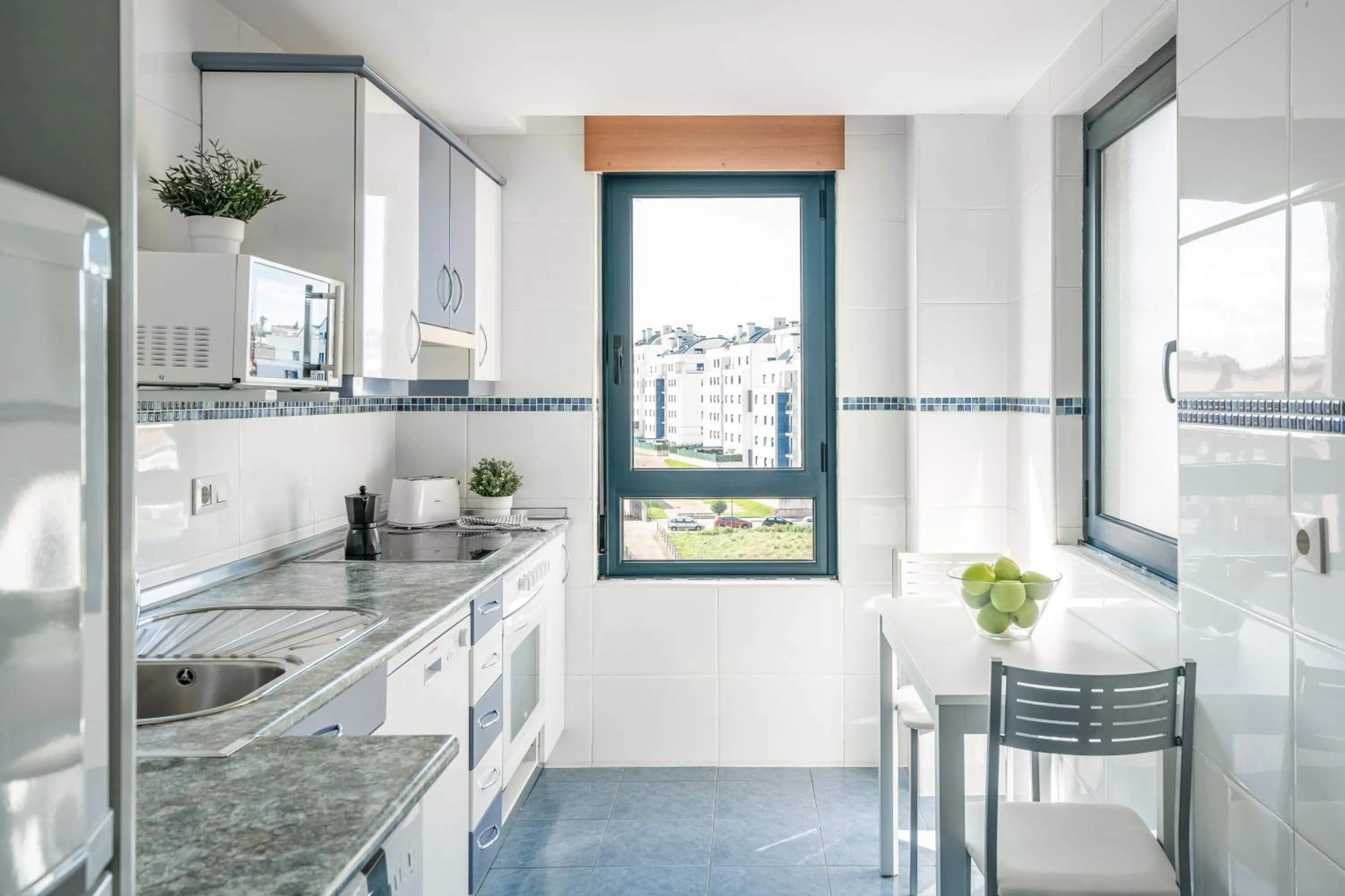 Kitchen or kitchenette in Apartamentos Alday