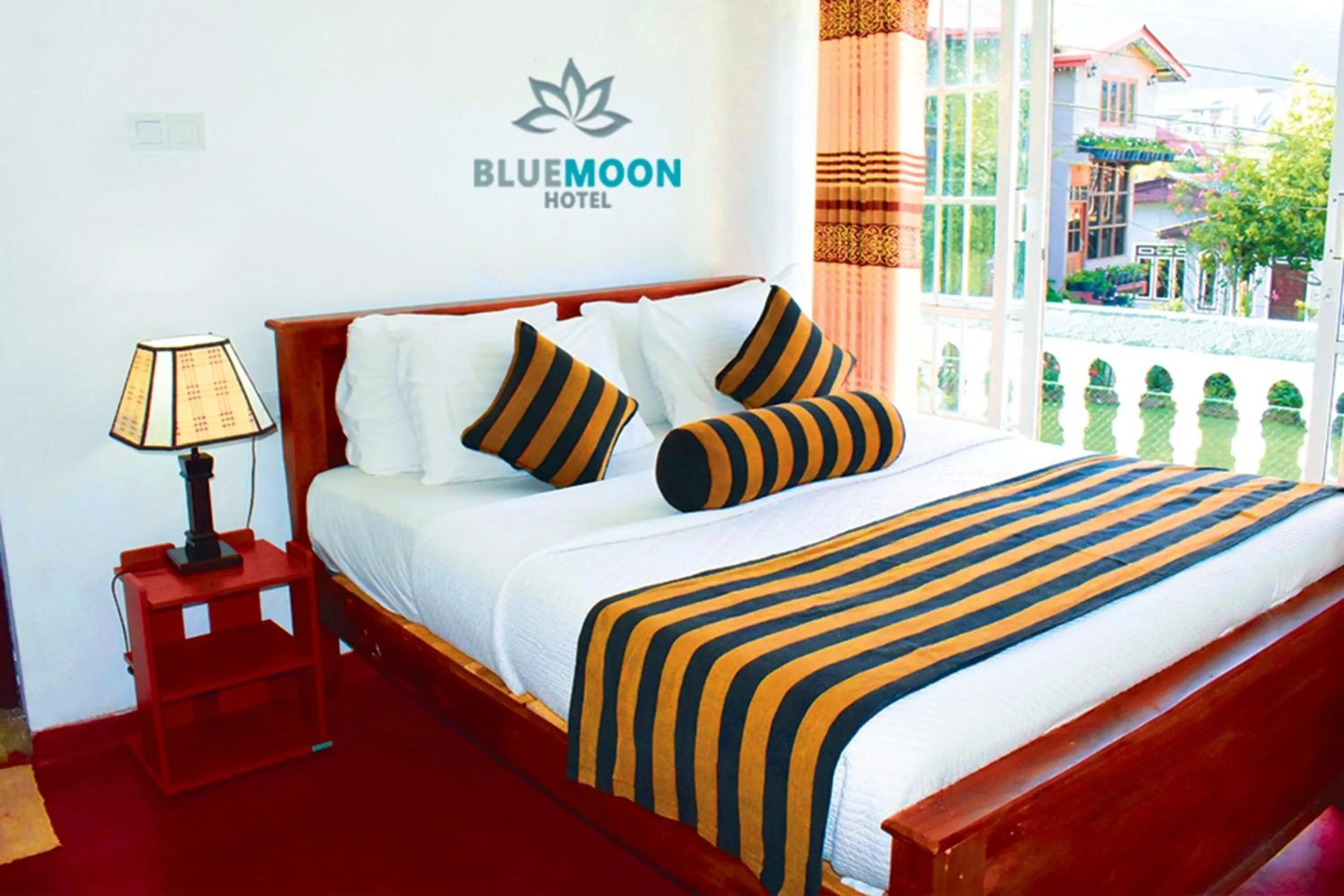 View (from property/room), Bed in Blue Moon Hotel