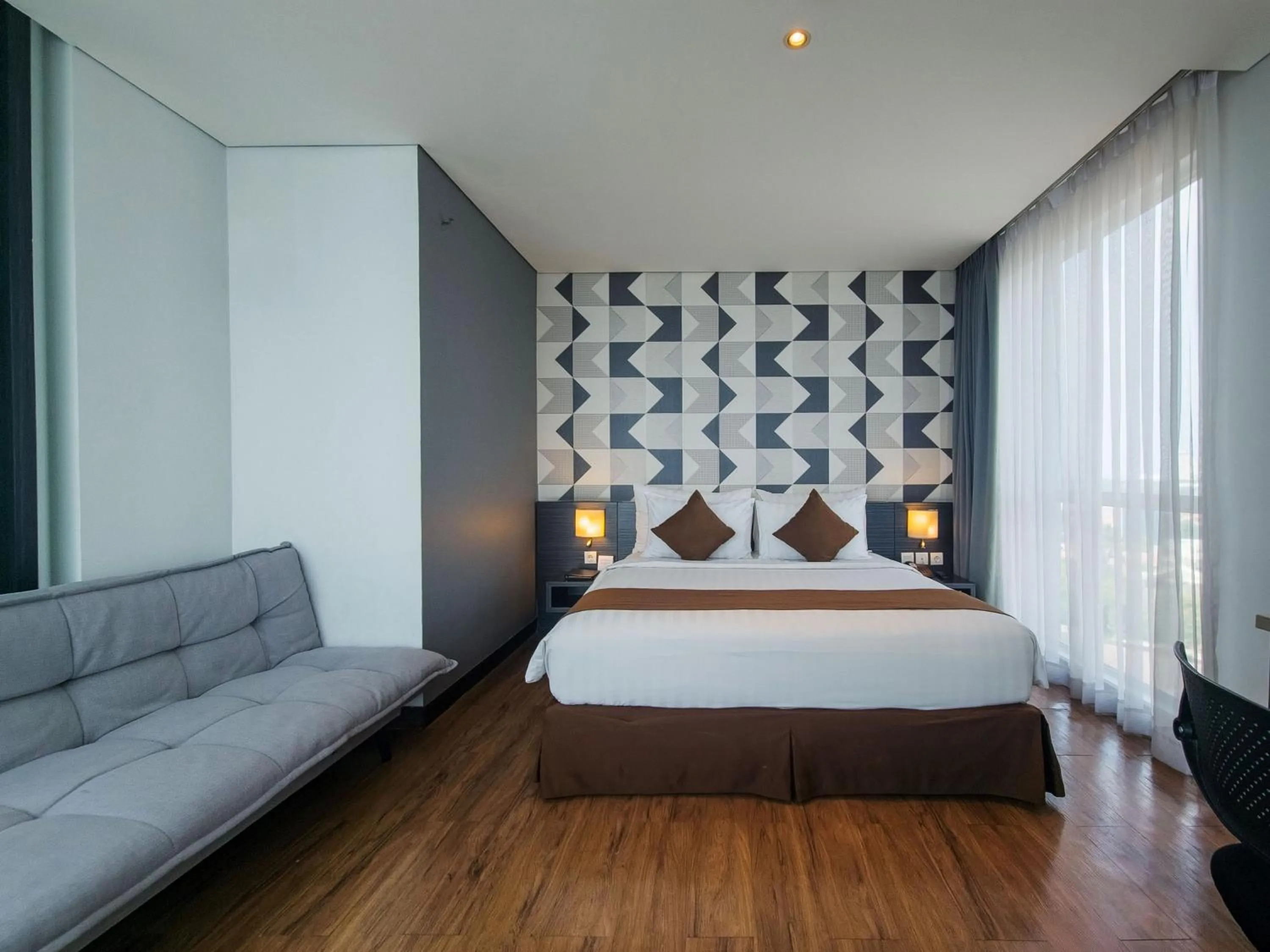 Bed in Luminor Hotel Jemursari By WH with The Best Breakfast in Town and Located Near Surabaya Industrial Estate Rungkut SIER