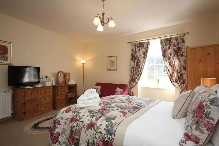 Bed in Dunster Mill House