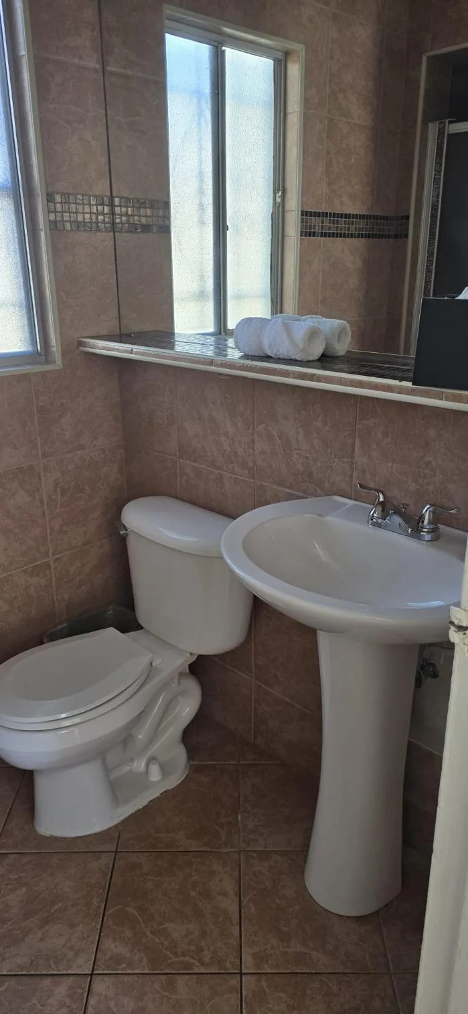 Toilet in Travelsuites Hotel