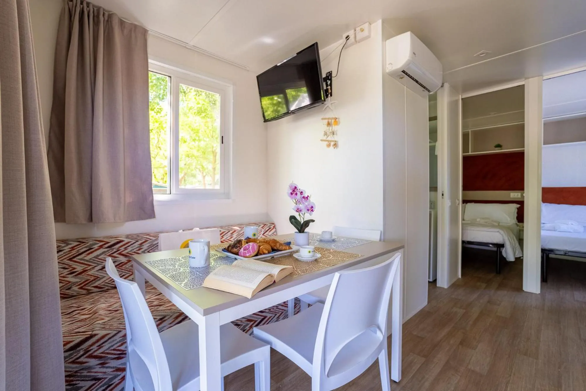 Living room, Bed in Club del Sole Adriatico Cervia Easy Camping Village