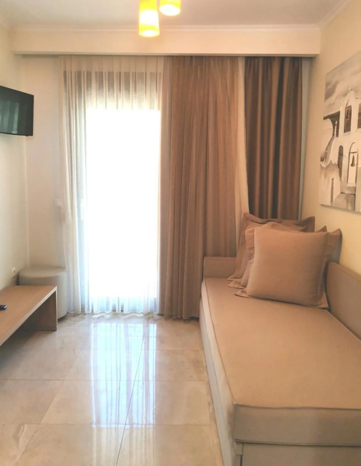 Living room, Bed in Artemis Plaza