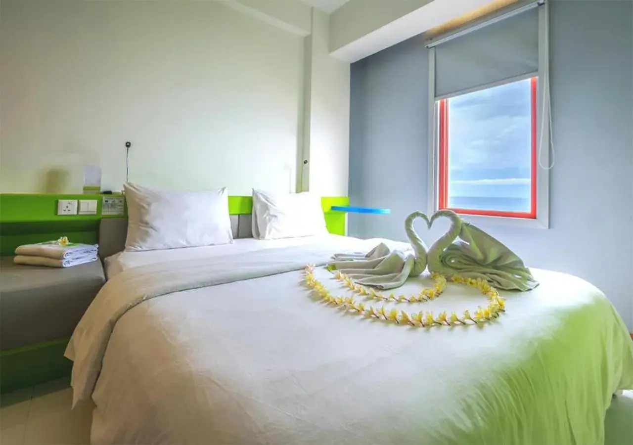 Bed in Singaraja Beach Hotel Bed in Singaraja Beach Hotel