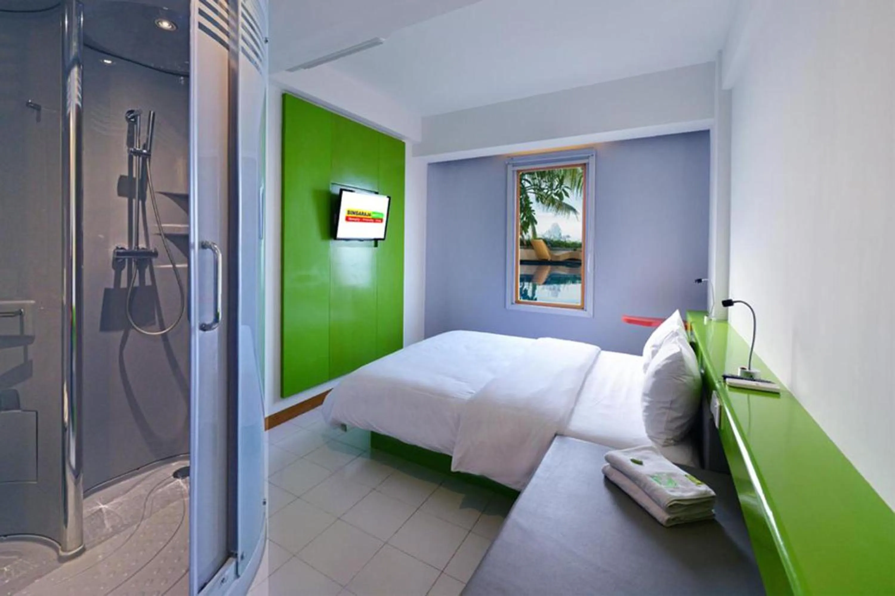 Bed in Singaraja Beach Hotel