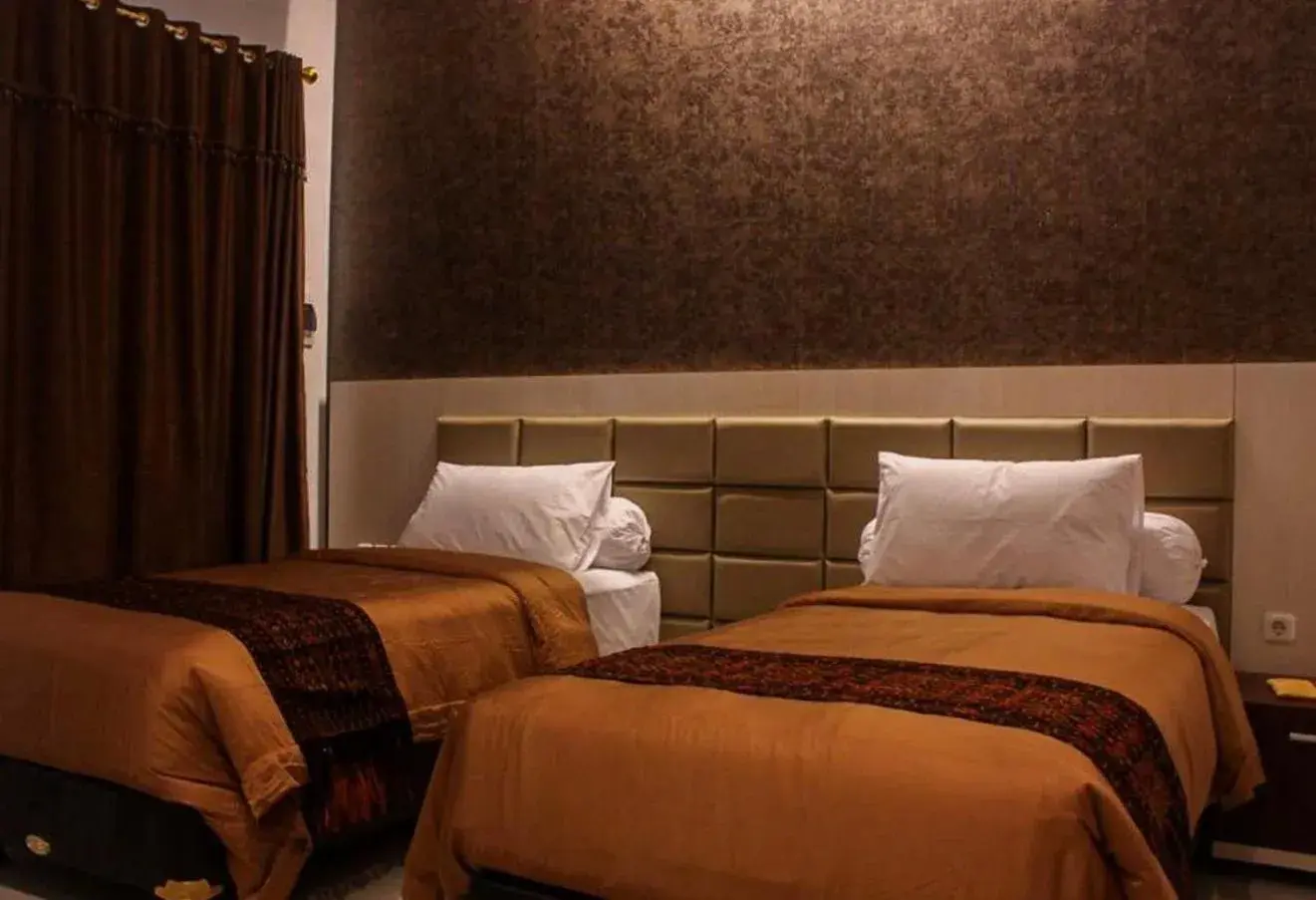 Bed in Tlogomas Guest House Bed in Tlogomas Guest House