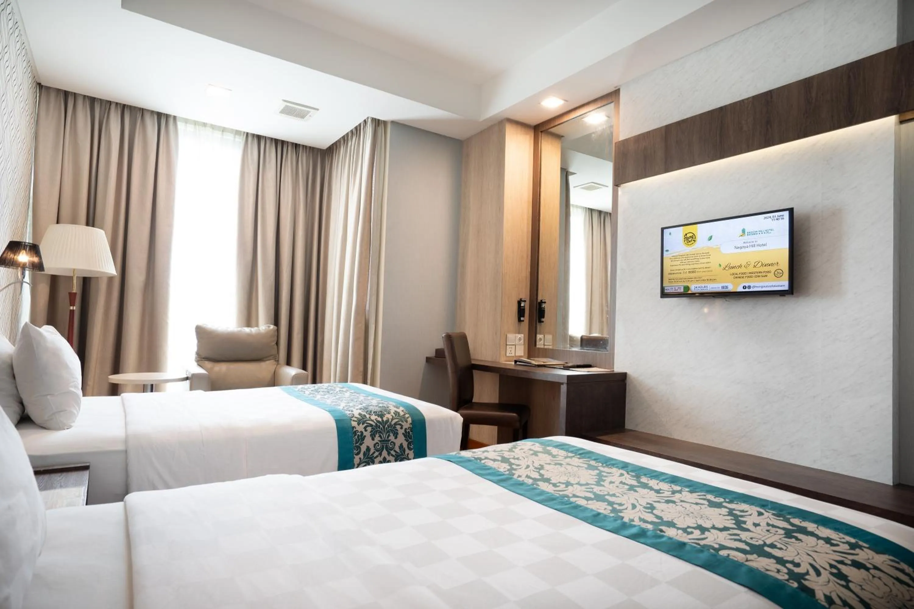Bed in Nagoya Hill Hotel Batam