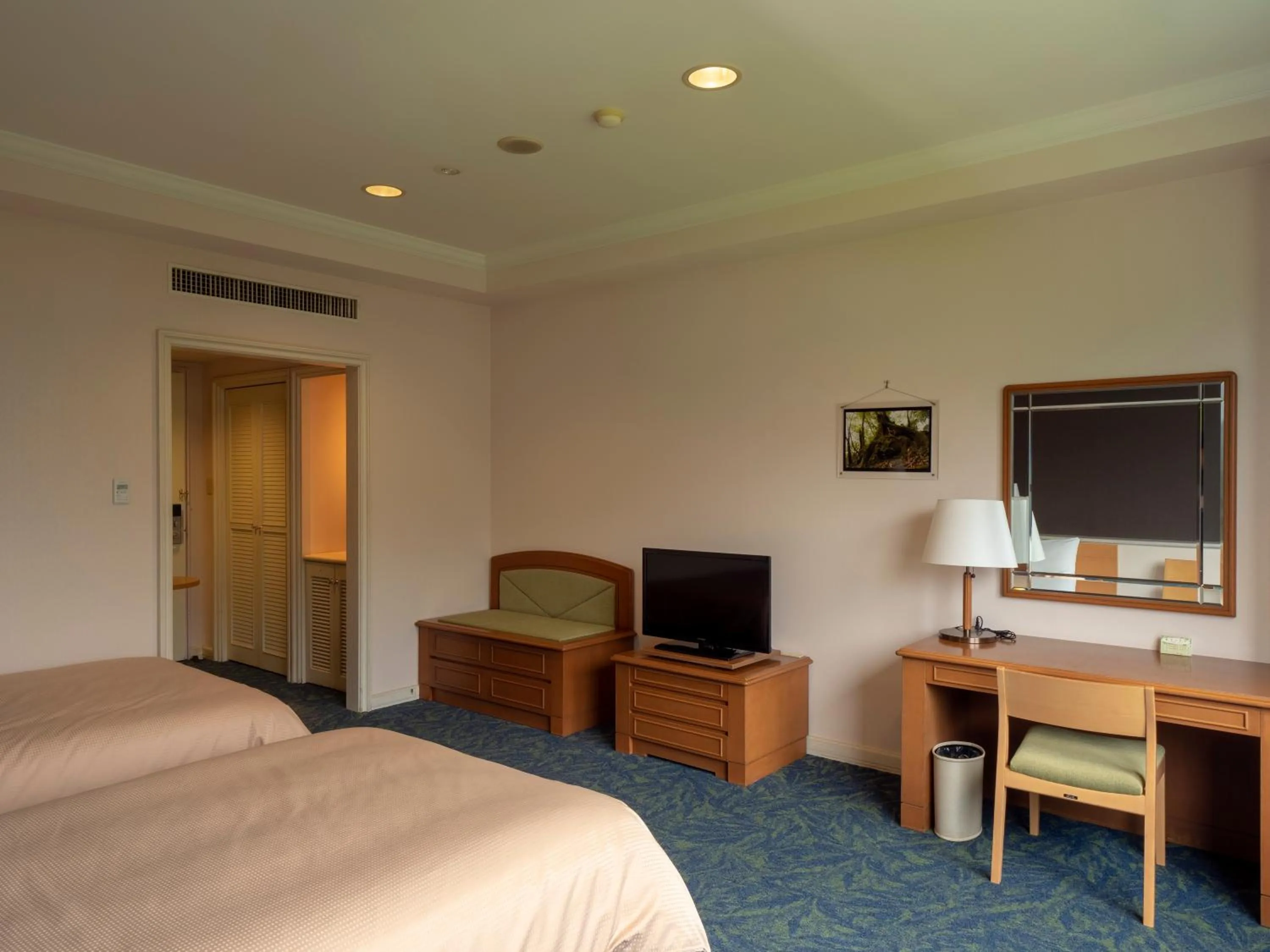 Bed in THE HOTEL YAKUSHIMA ocean & forest