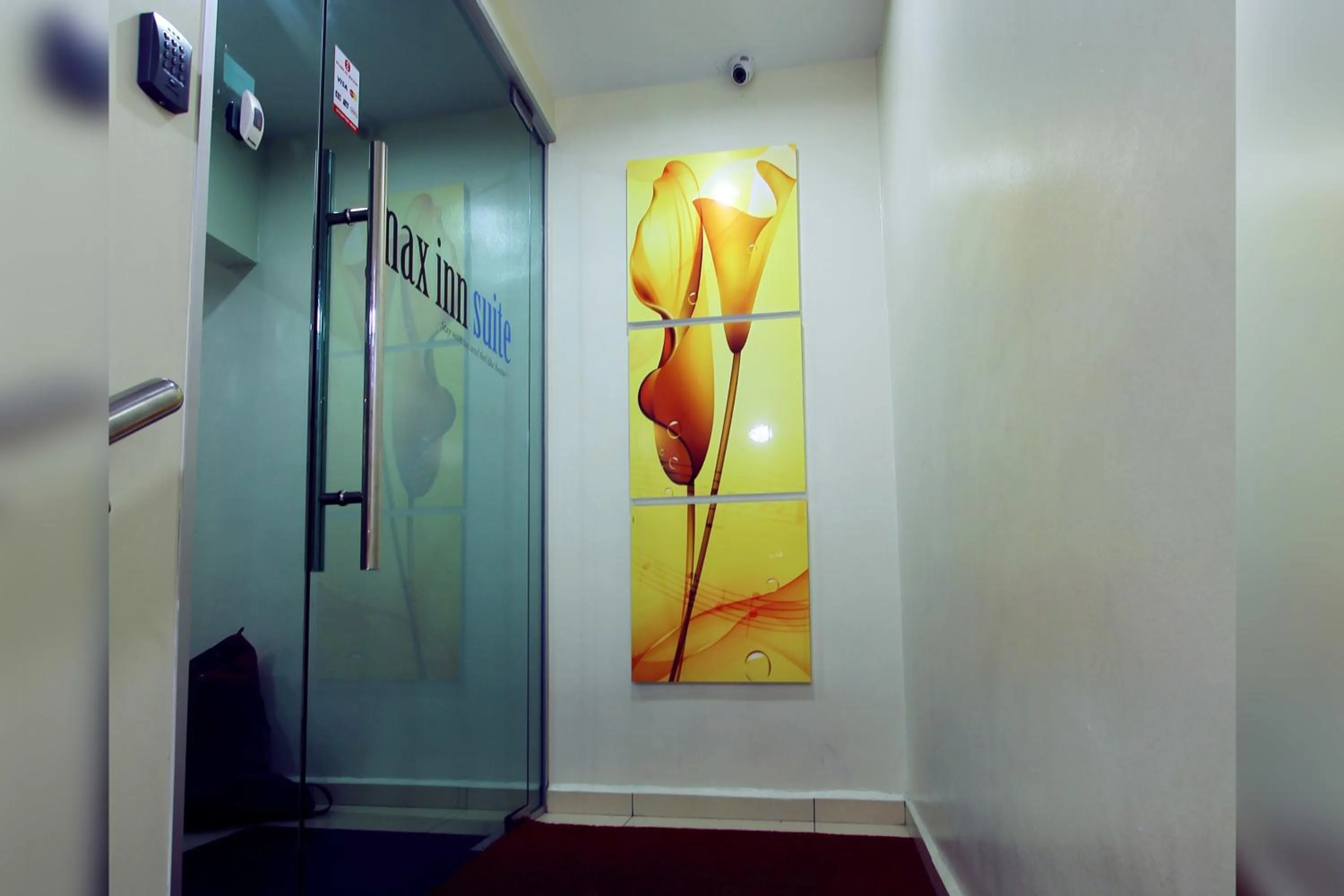 Property logo or sign in Max Inn Hotel