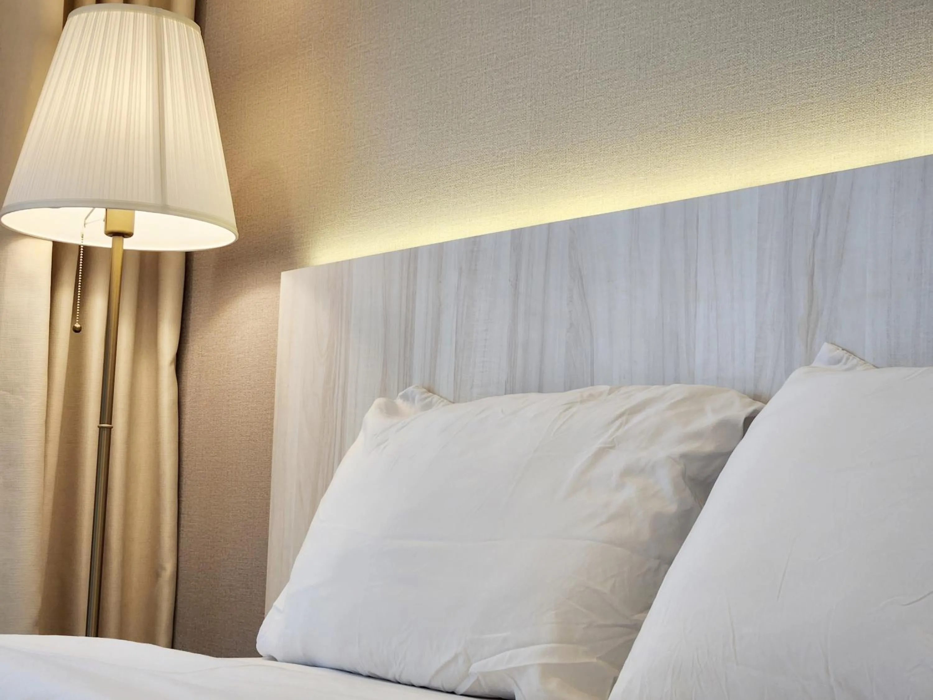 Bed in SKS Pavillion Suites