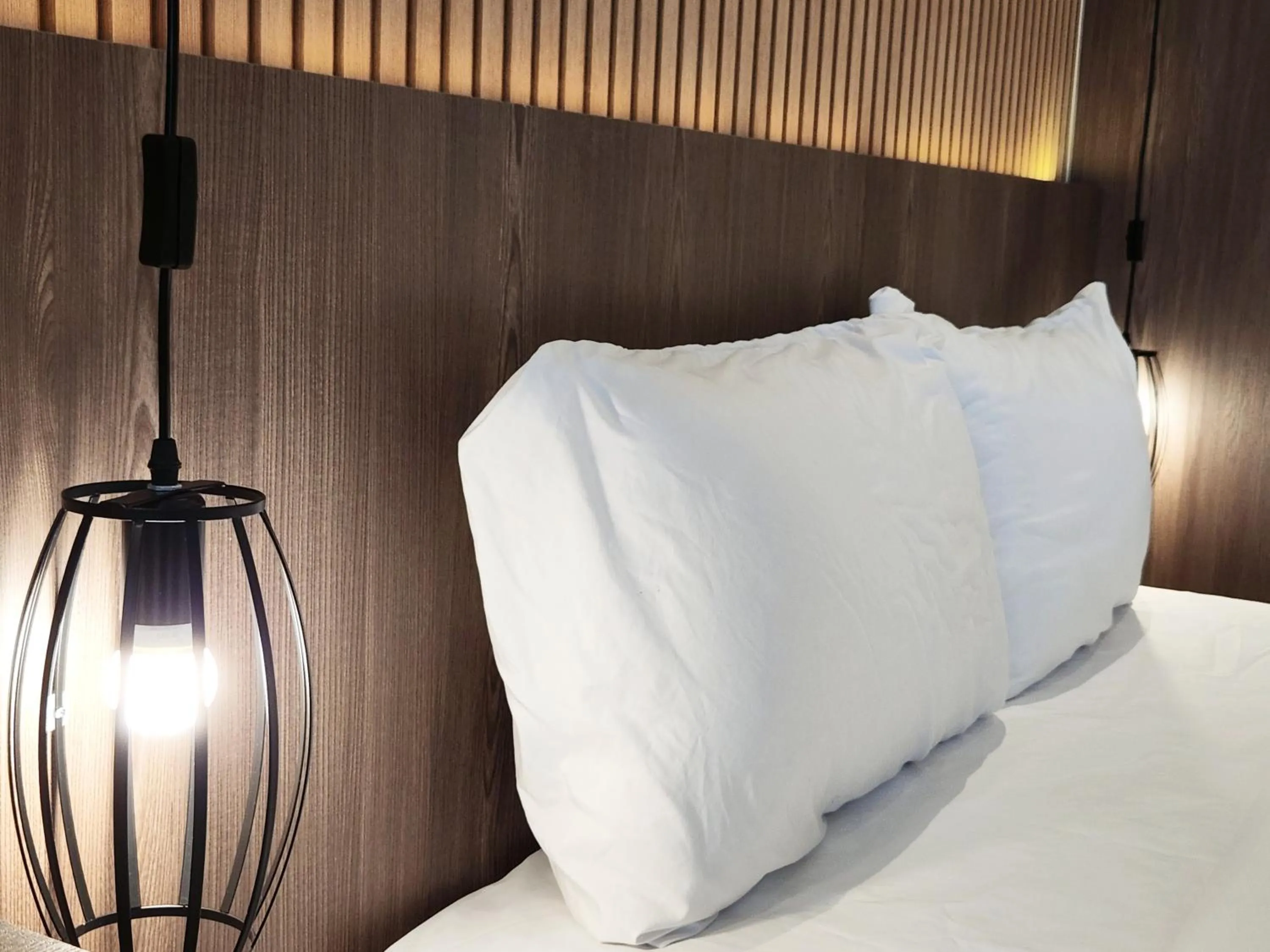 Bed in SKS Pavillion Suites