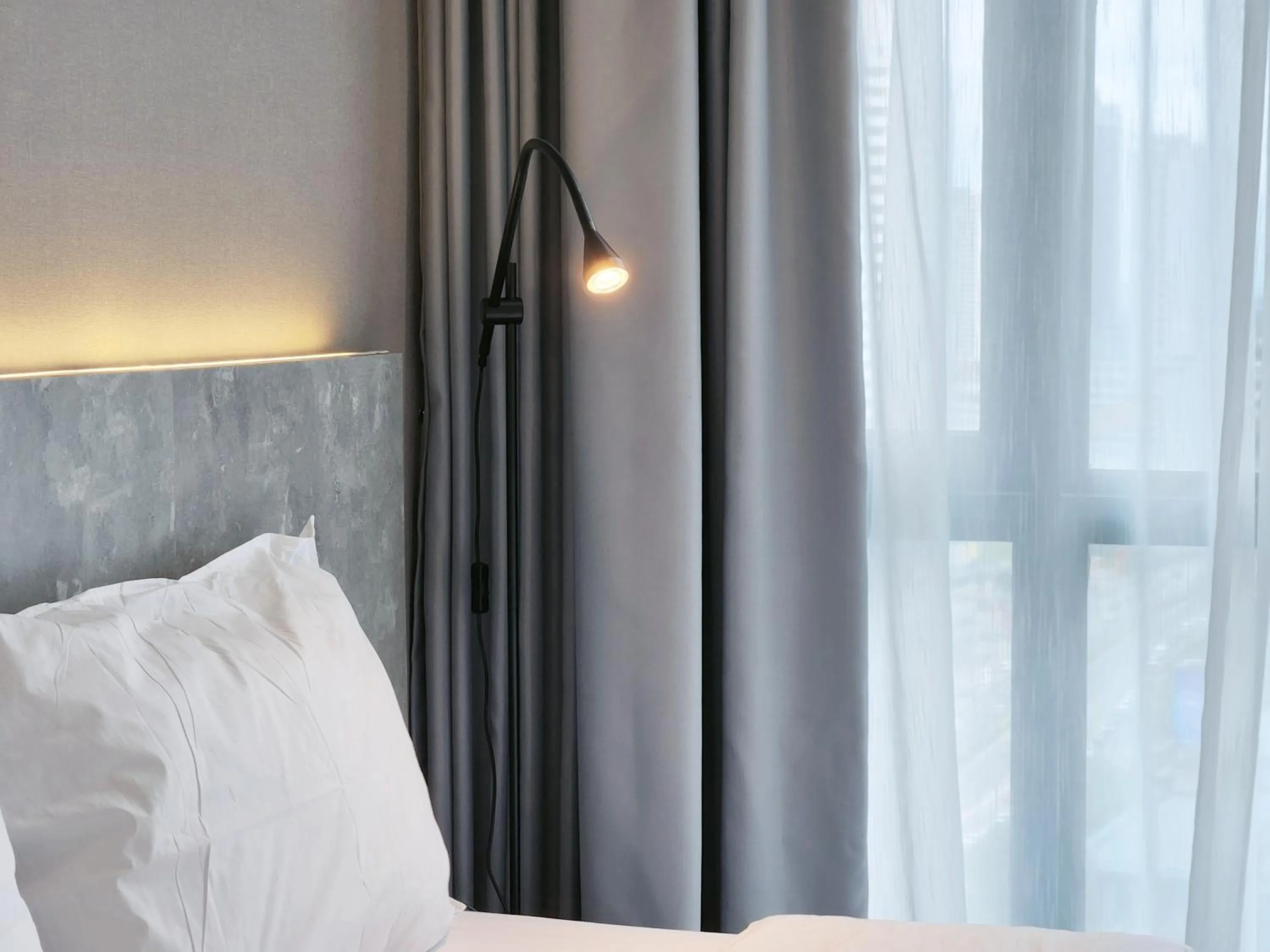 Bed in SKS Pavillion Suites