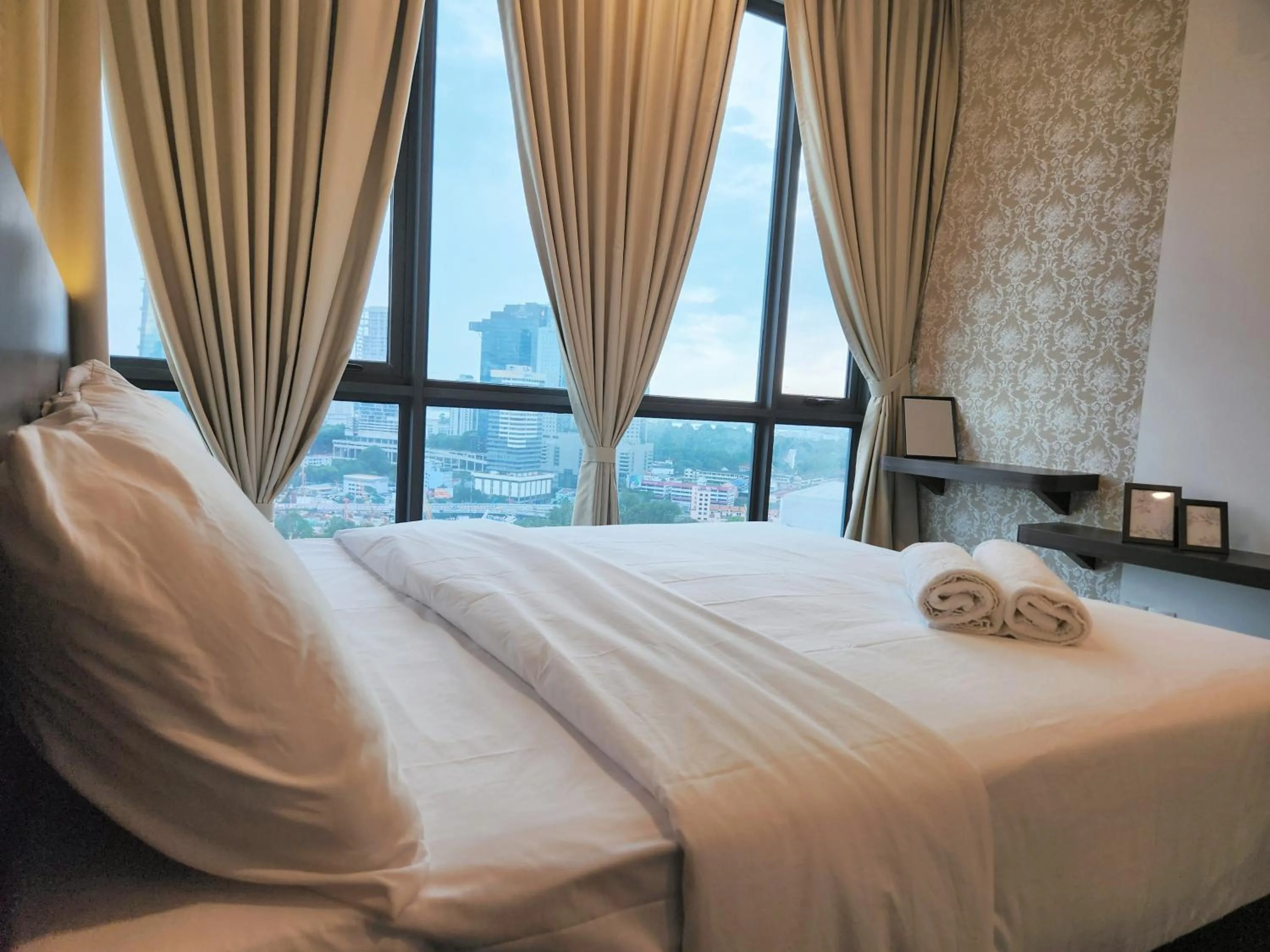 Bed in SKS Pavillion Suites