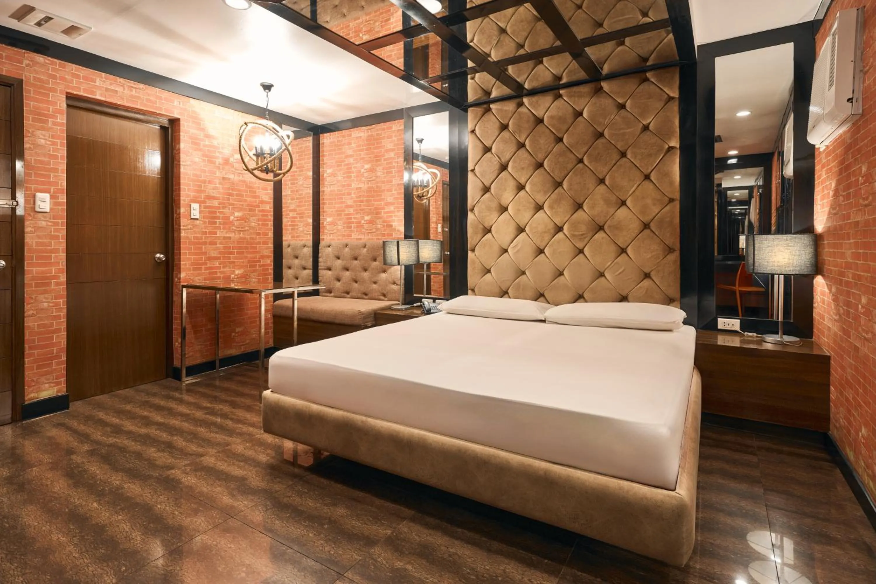 Photo of the whole room, Bed in Victoria Court Las Pinas