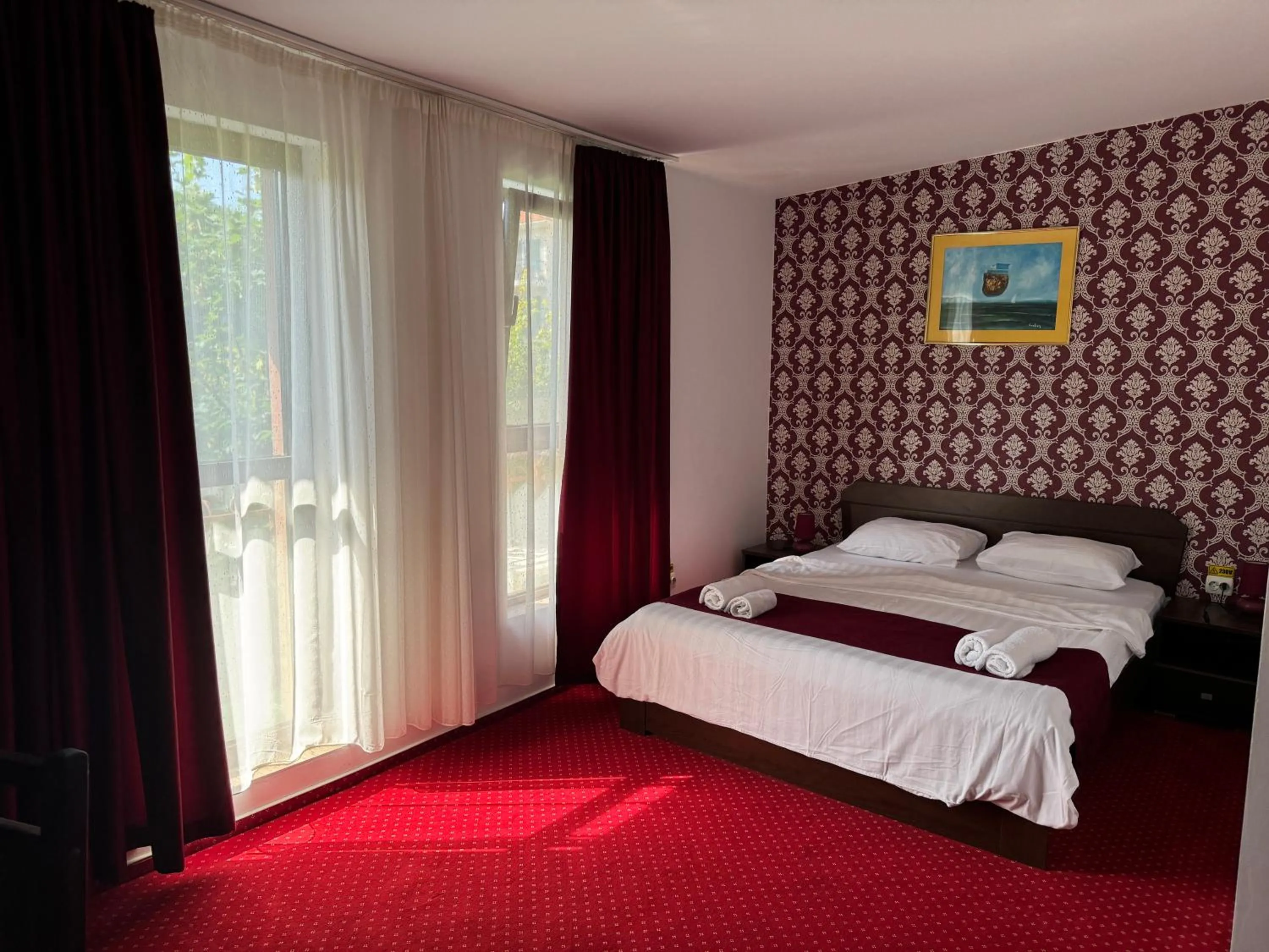 Bed in Hotel Hermes