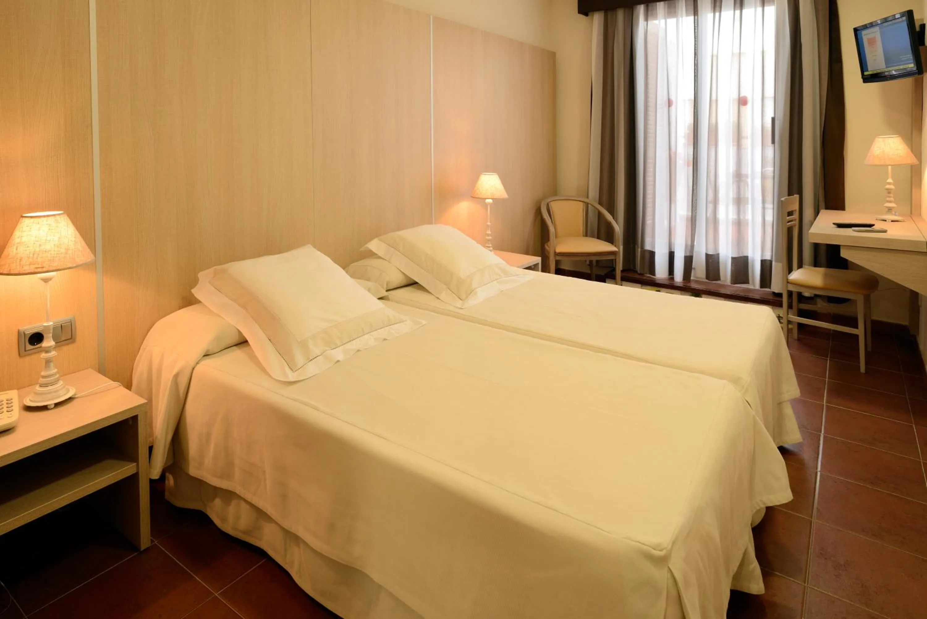 Bed in Hotel Capri