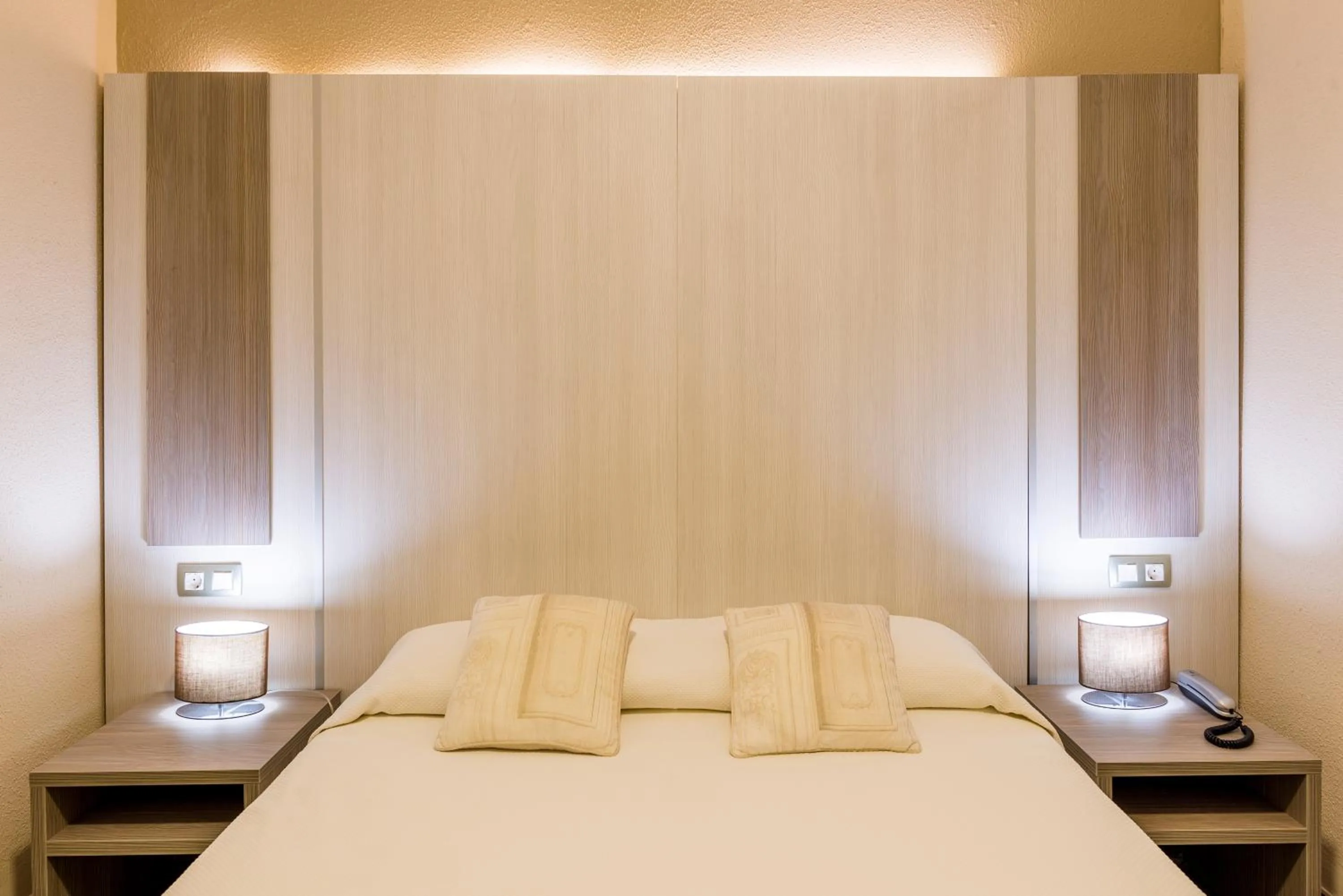 Bed in Hotel Capri