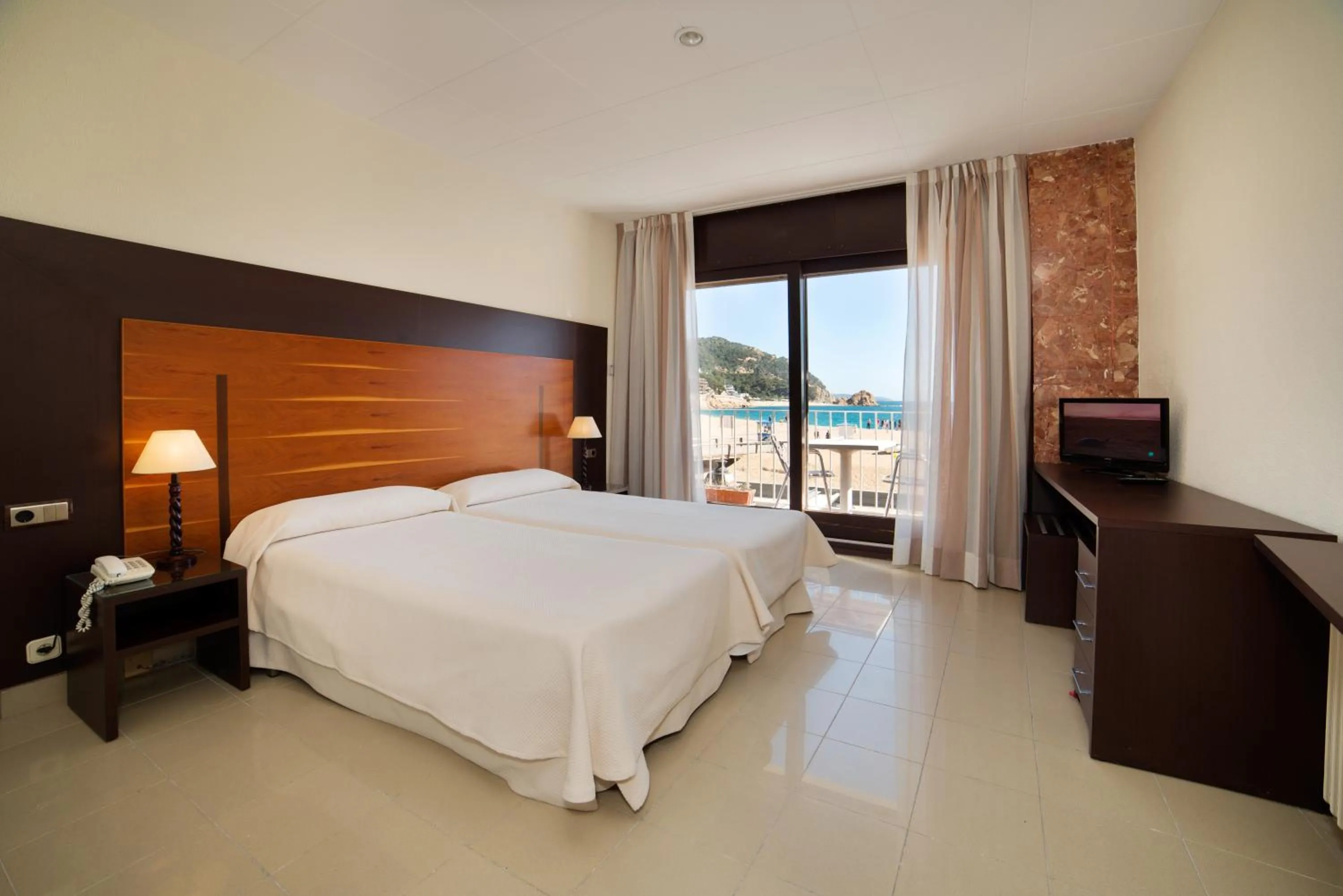 Bed in Hotel Capri