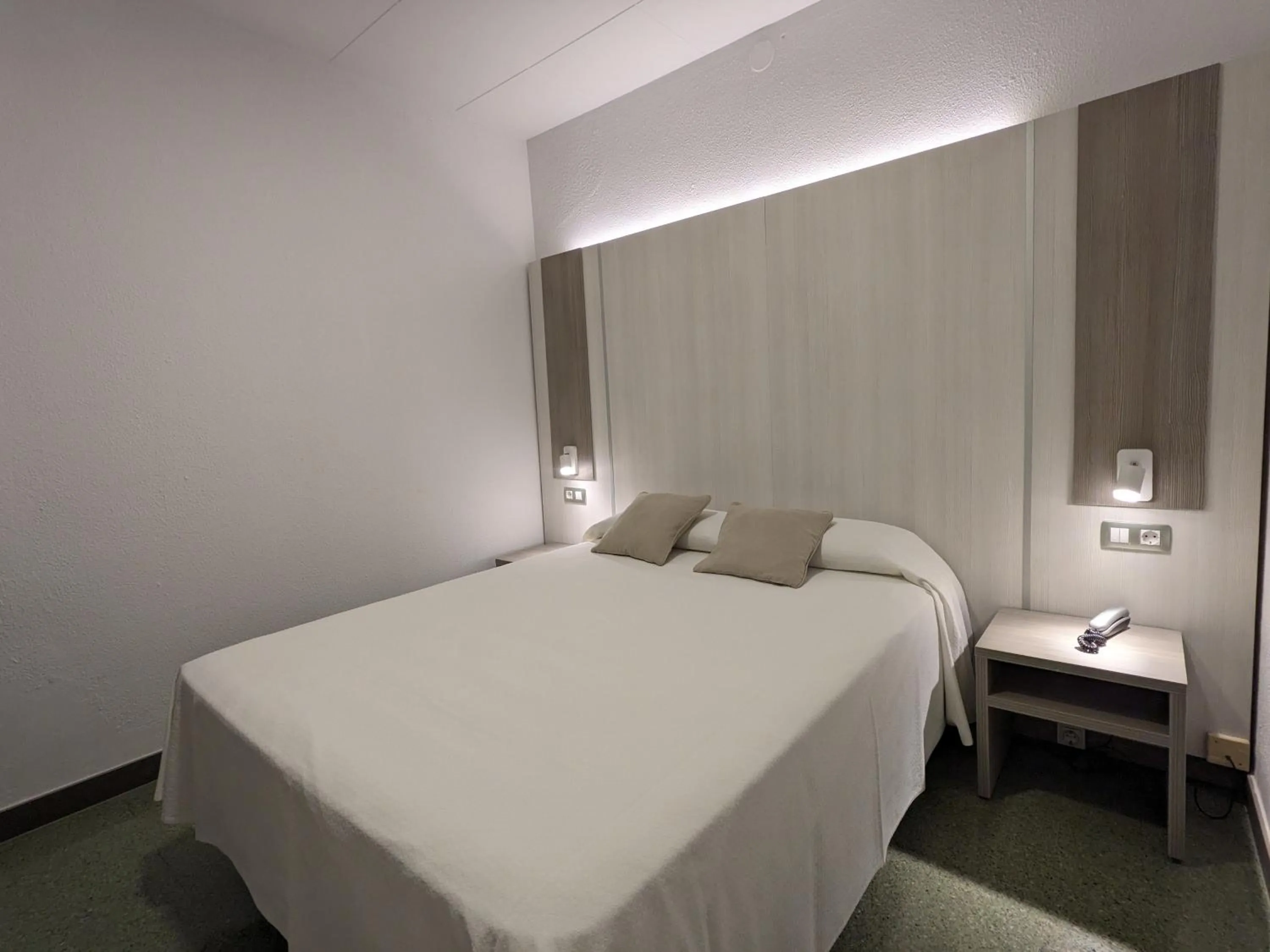Bed in Hotel Capri