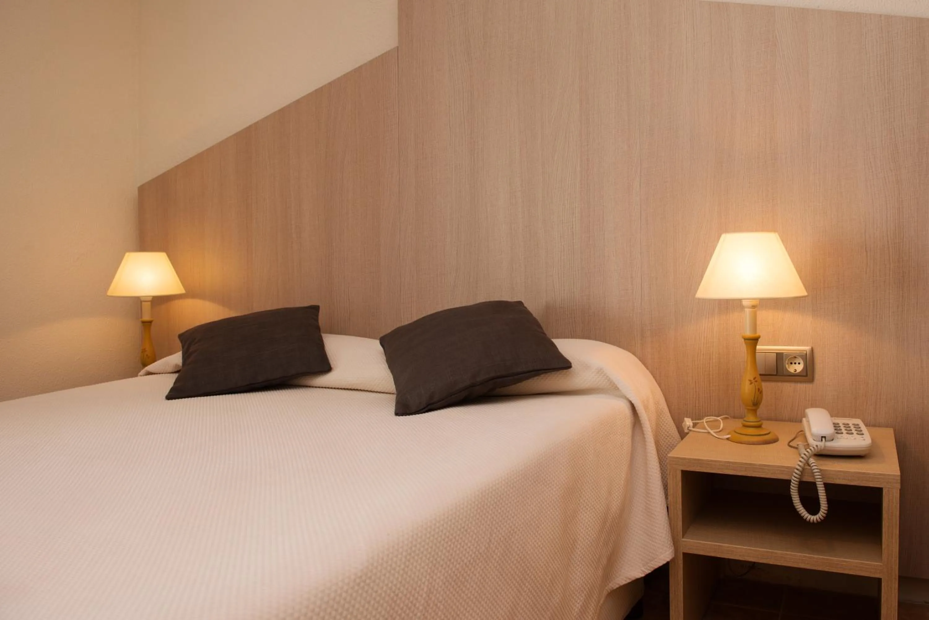 Bed in Hotel Capri