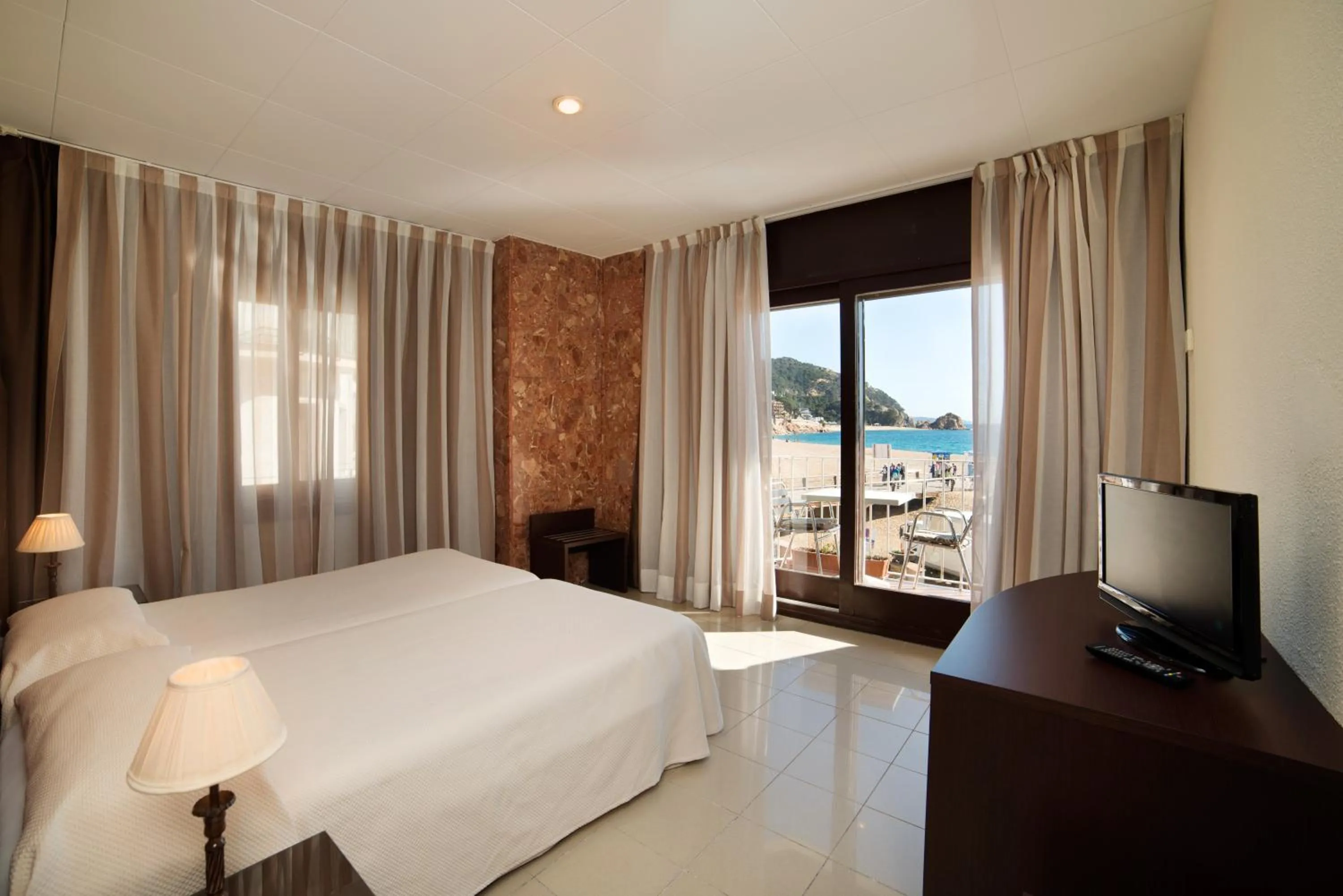 Bed in Hotel Capri