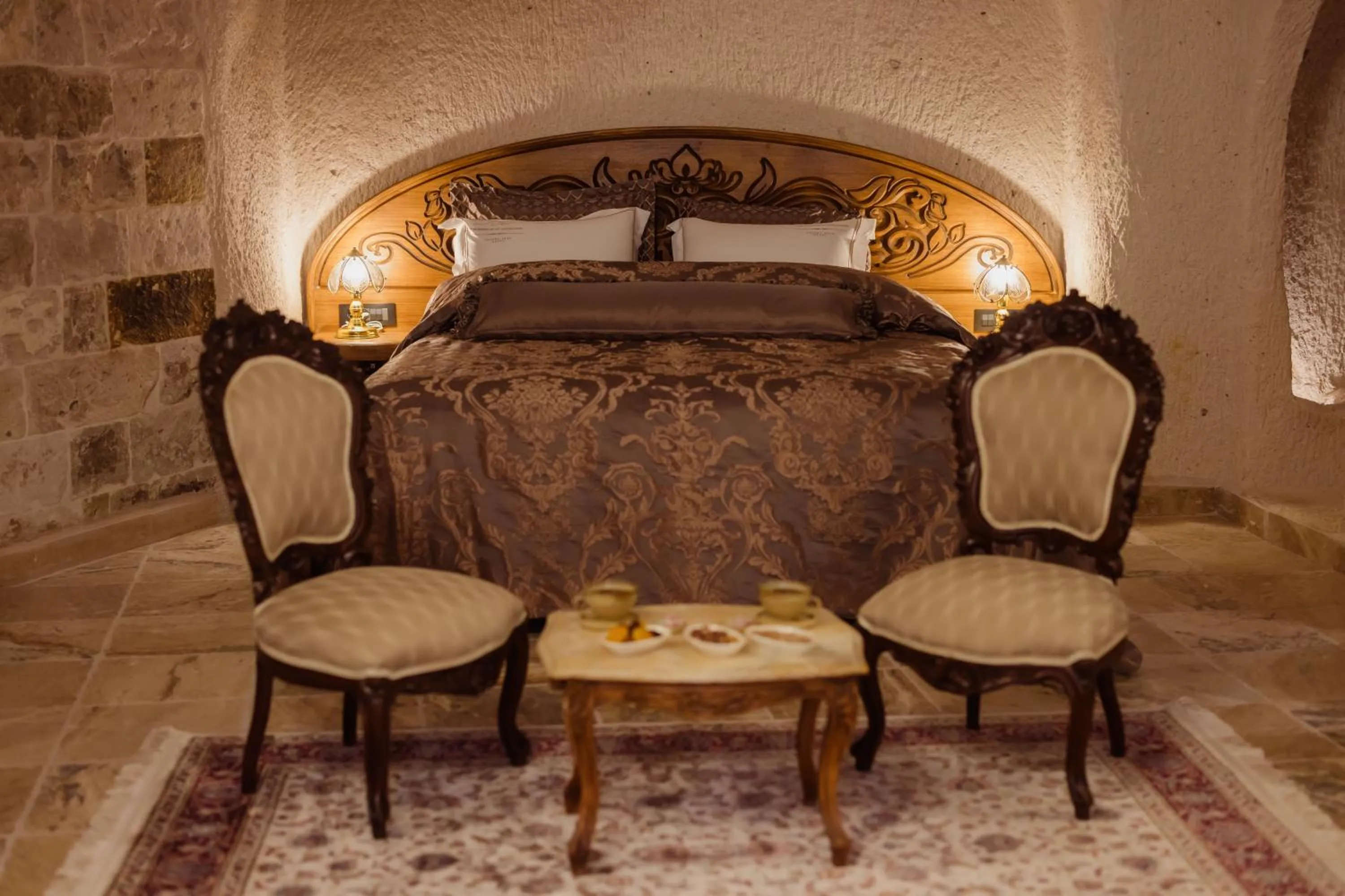 Bed in The Kingdom Of Cappadocia Luxury Cave Hotel