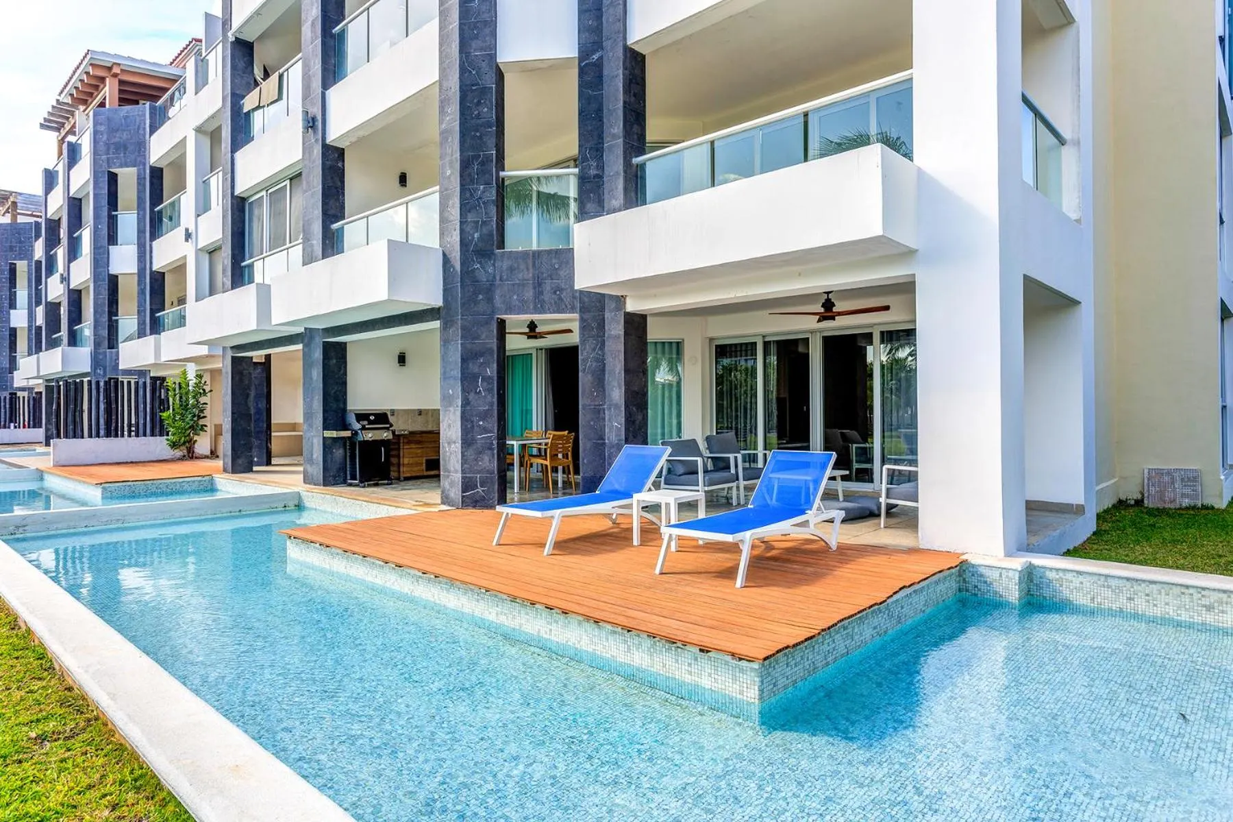 Property building in Luxury Condos at Mareazul Beachfront Complex with Resort-Style Amenities