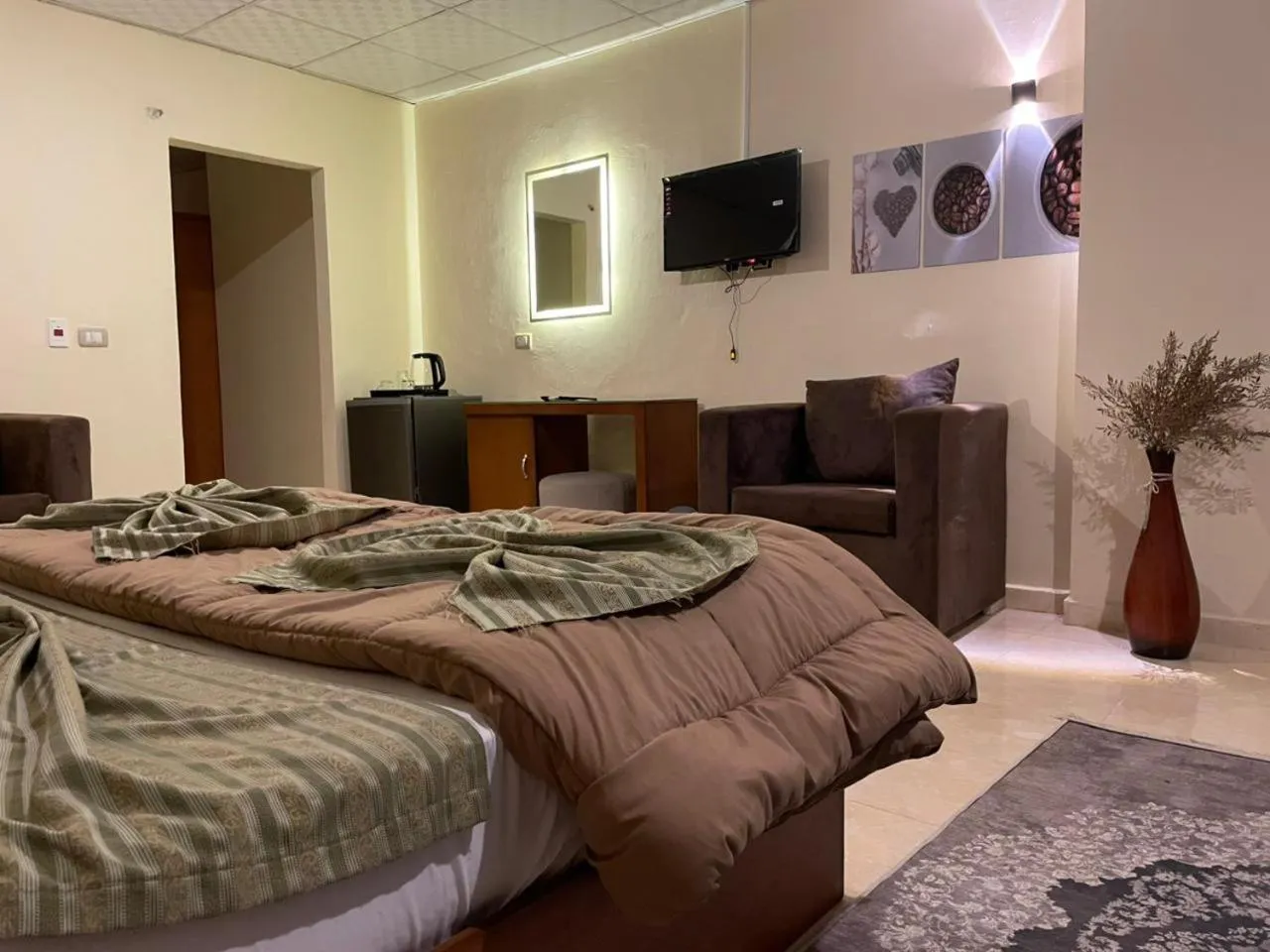 Bed in Verssailles Pyramids Hotel