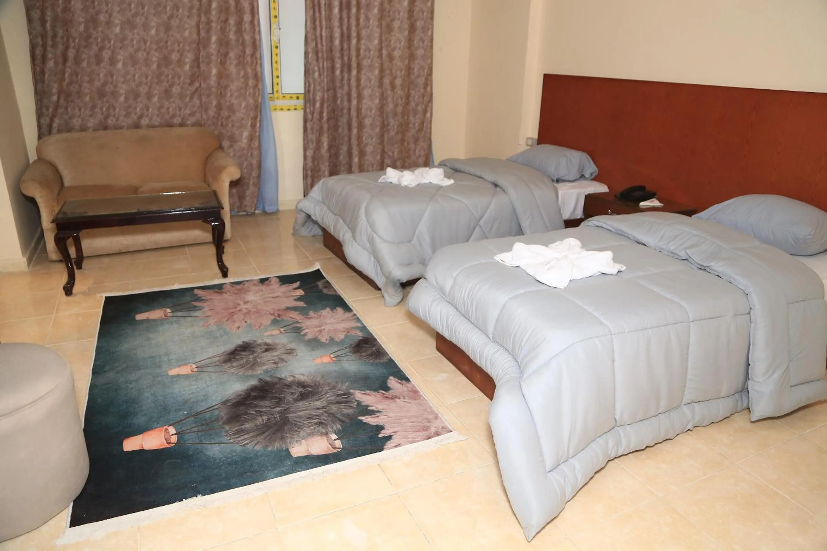 Bed in Verssailles Pyramids Hotel