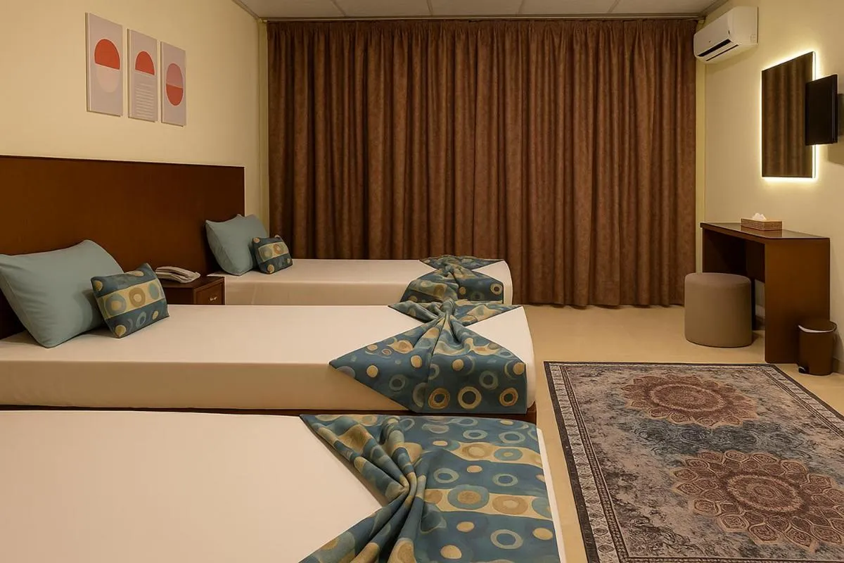 Bed in Verssailles Pyramids Hotel