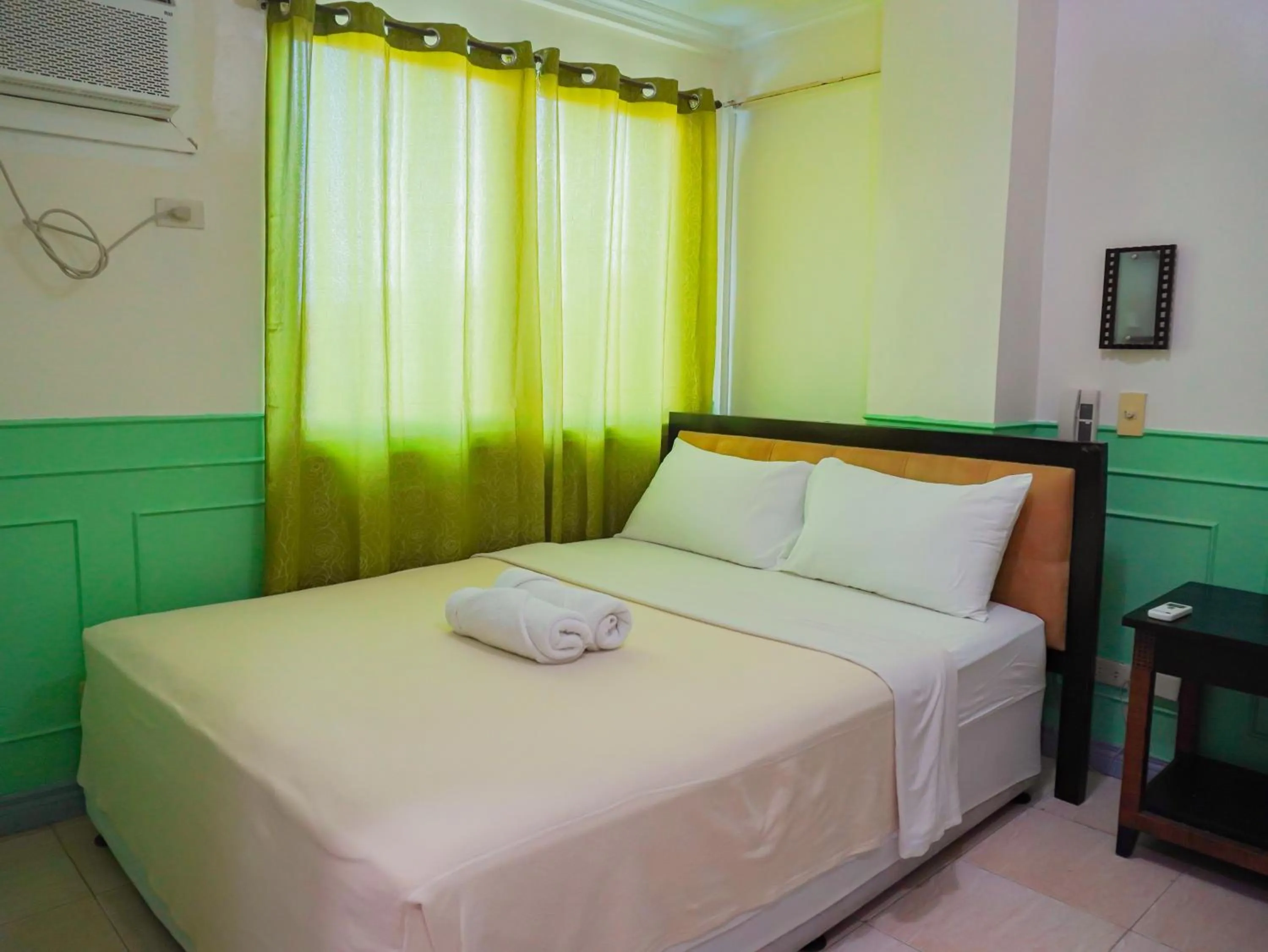 Bed in Boracay Paradise Hotel