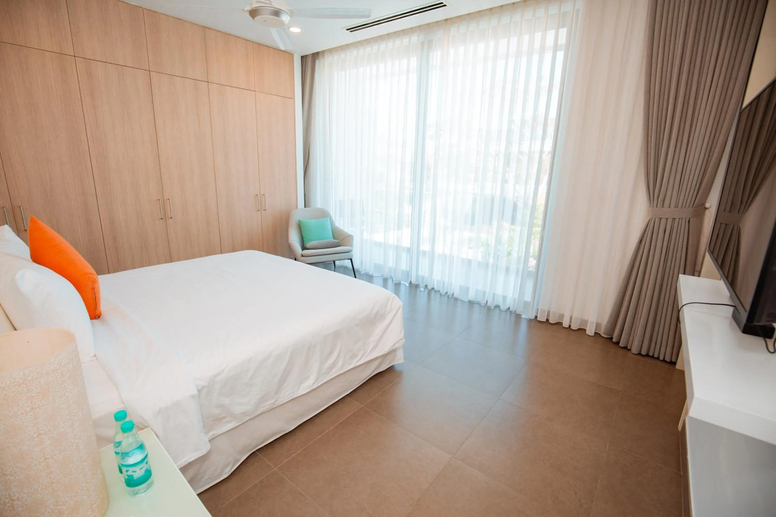 Bed in Beachfront 4 Bedrooms private pool villa Sanctuary Ho Tram resort