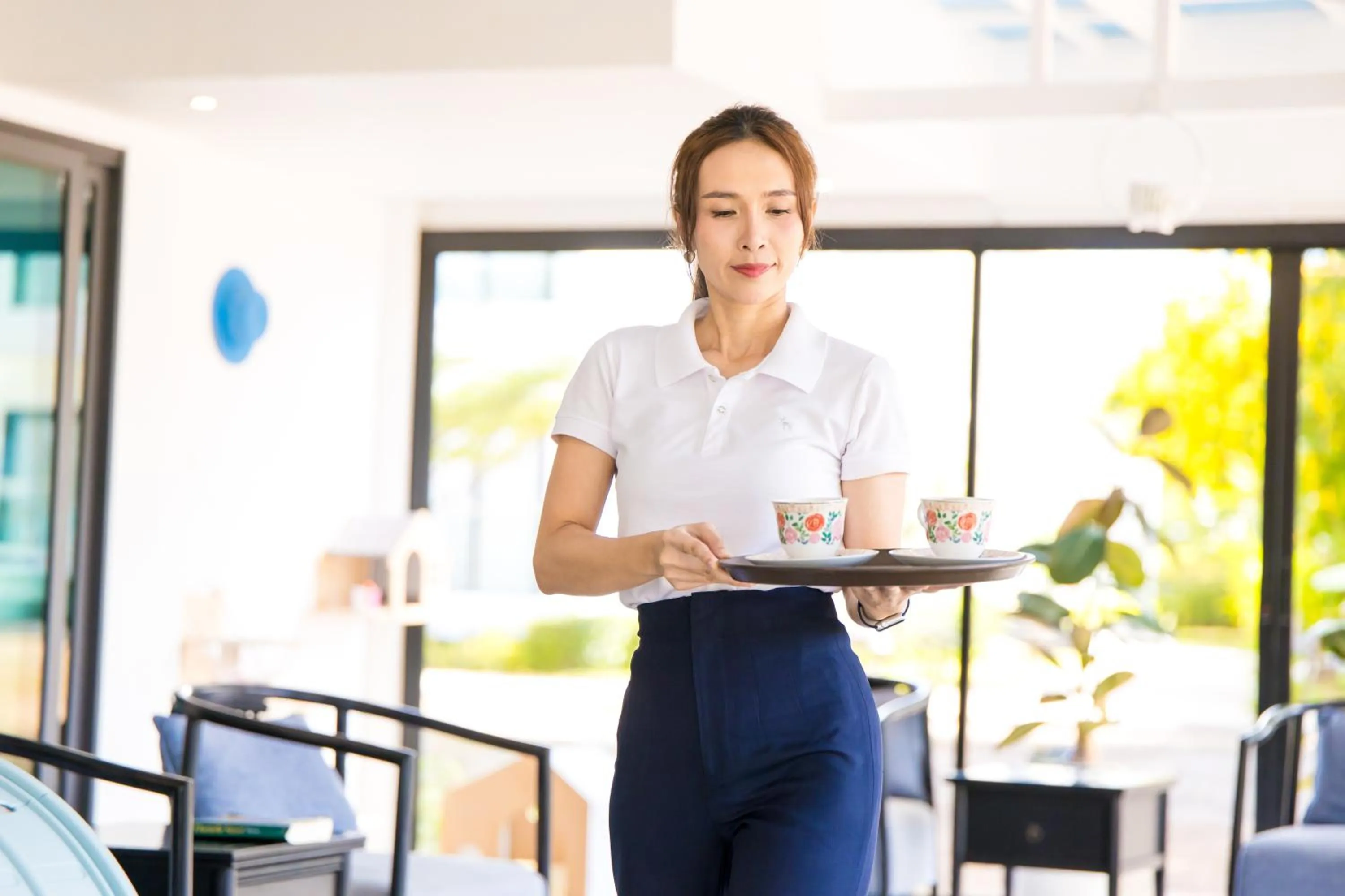 Communal lounge/ TV room in BJ & Radisson Sea View Hotel