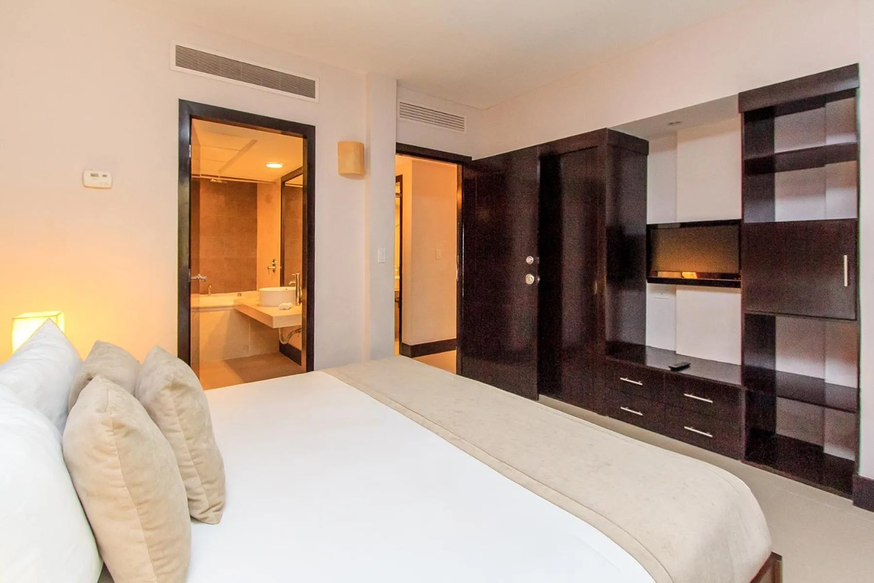 Bed in Aldea Thai by Stella Rentals