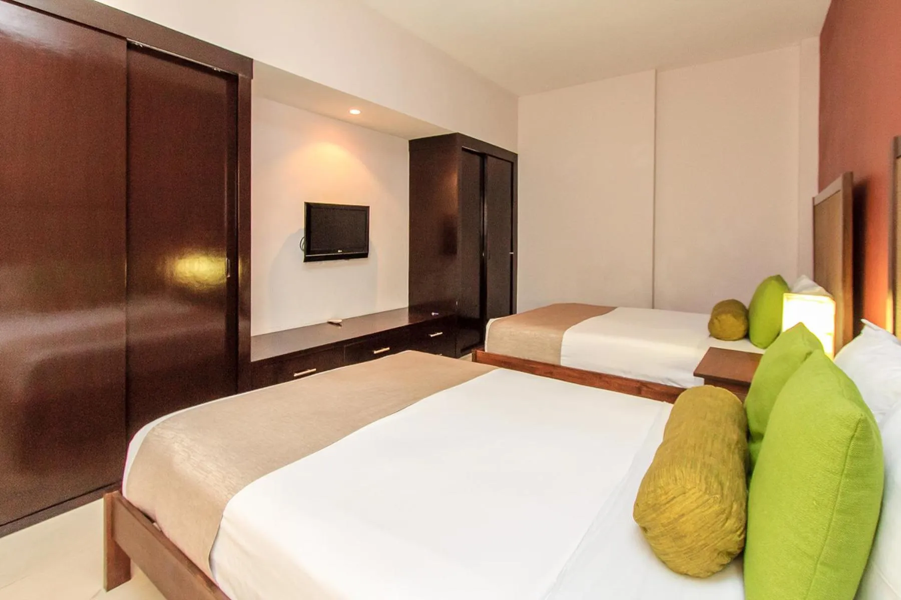 Bed in Aldea Thai by Stella Rentals