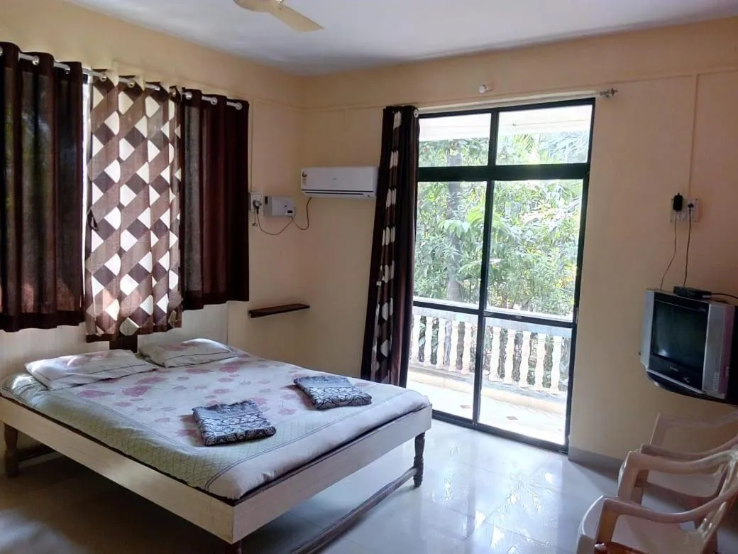 Bed in Tendulkar Beach Resort