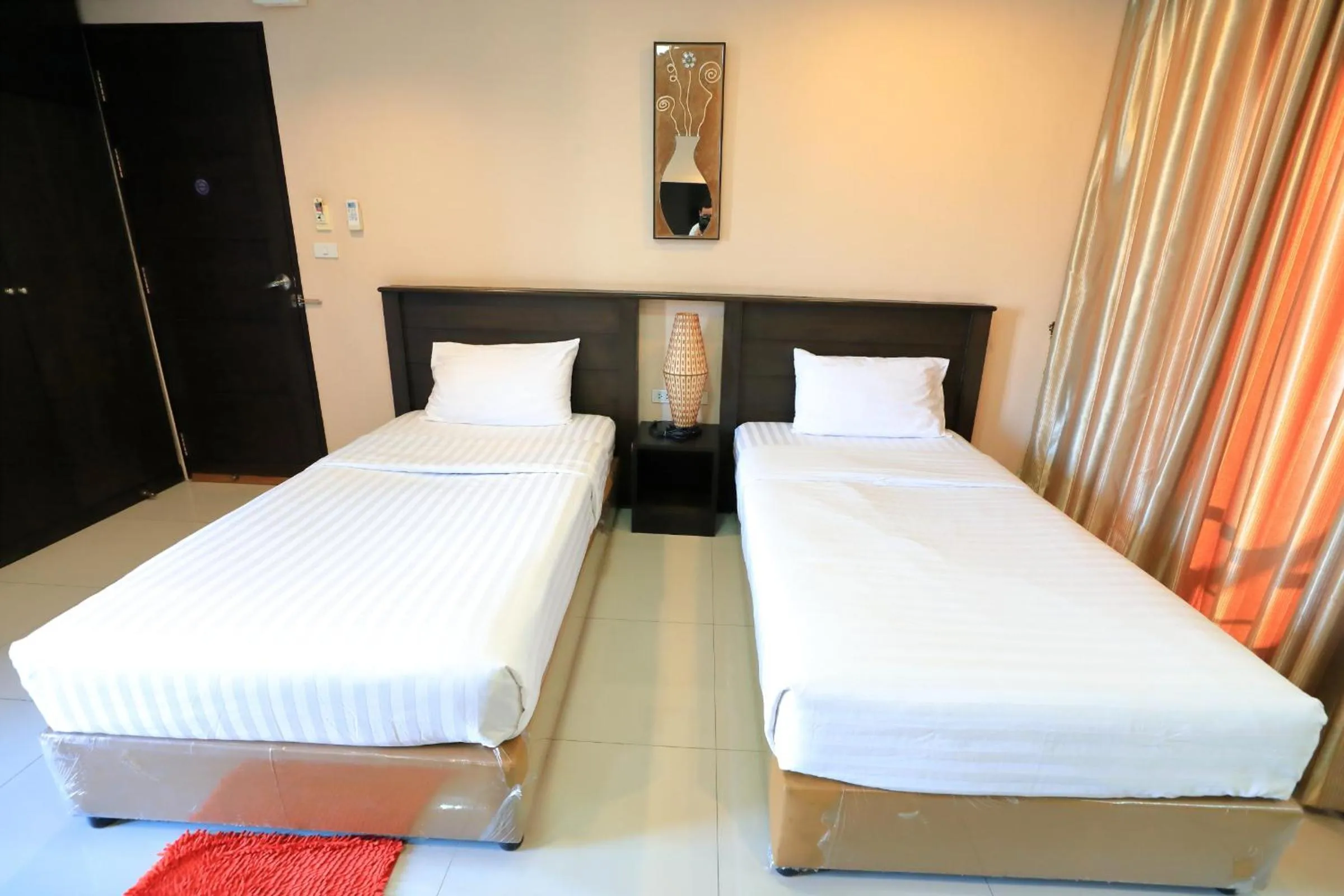 Bed in Triton Hotel Nakhonratchasima โรงแรมไททัน