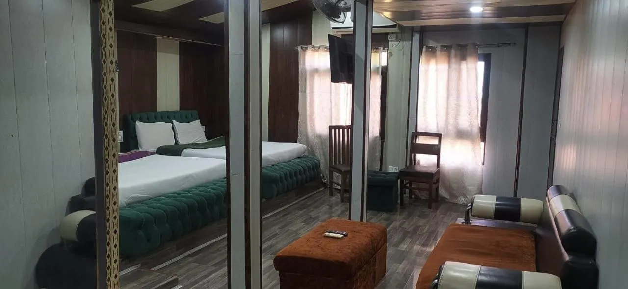 Bed in Heavenwood Heritage Hotel By Urban Inn Resorts