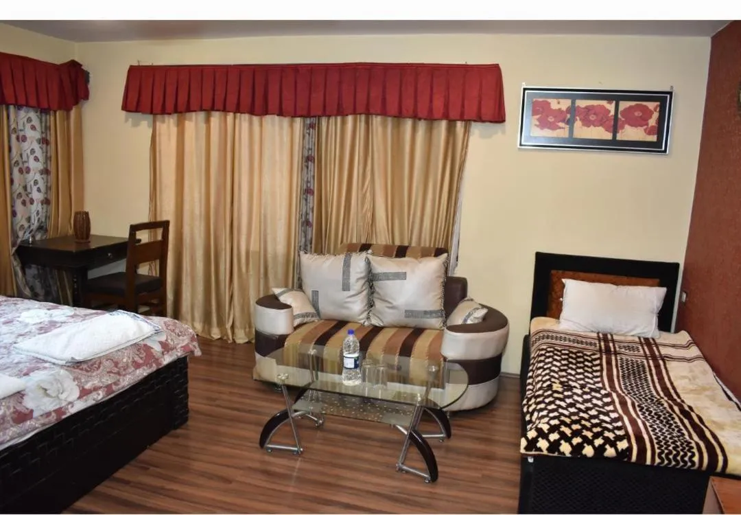 Bed in Heavenwood Heritage Hotel By Urban Inn Resorts
