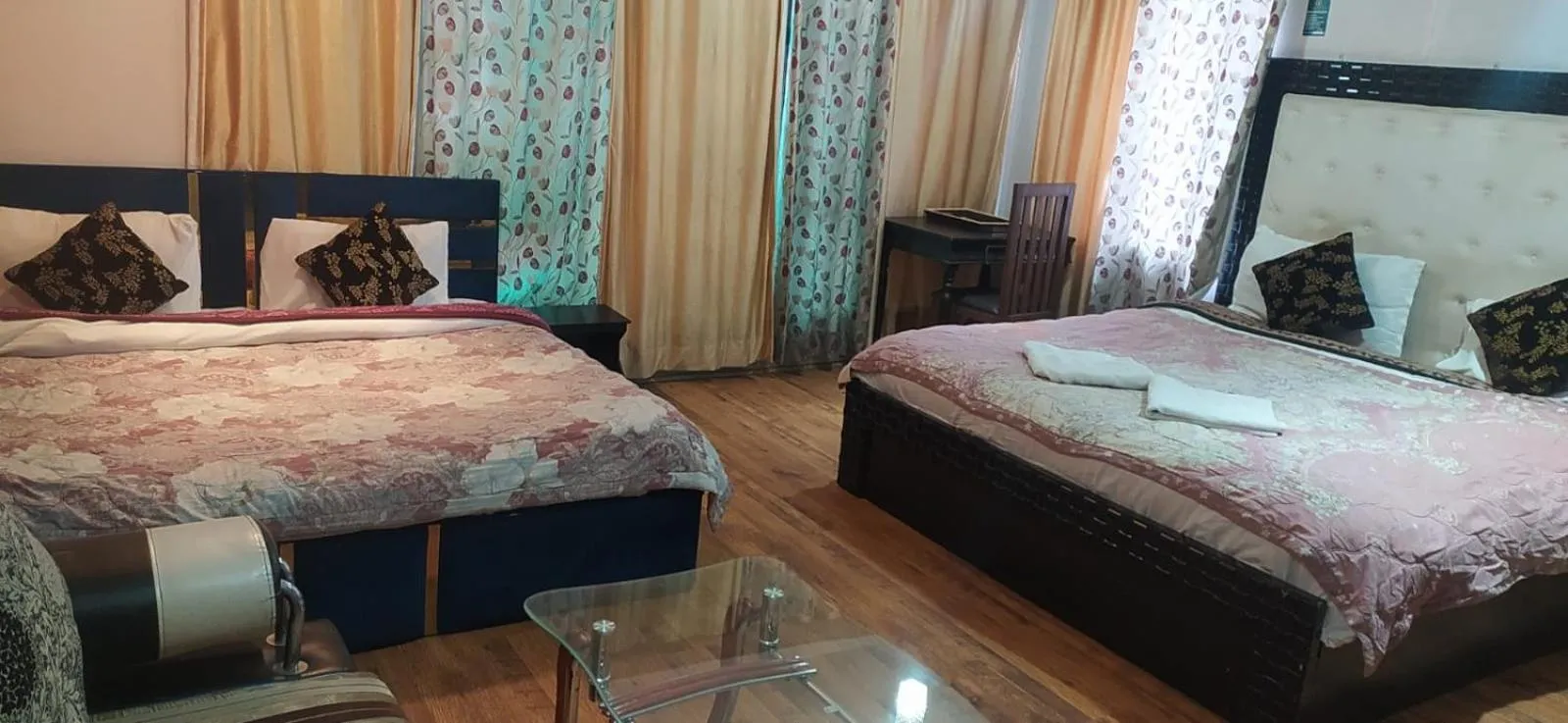 Bed in Heavenwood Heritage Hotel By Urban Inn Resorts