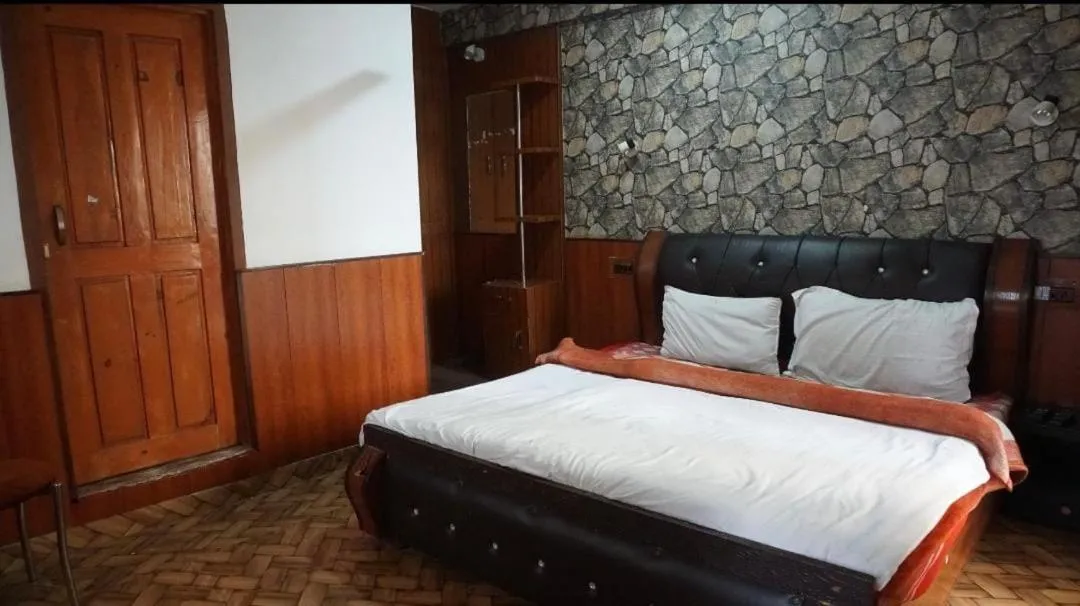 Bed in Heavenwood Heritage Hotel By Urban Inn Resorts