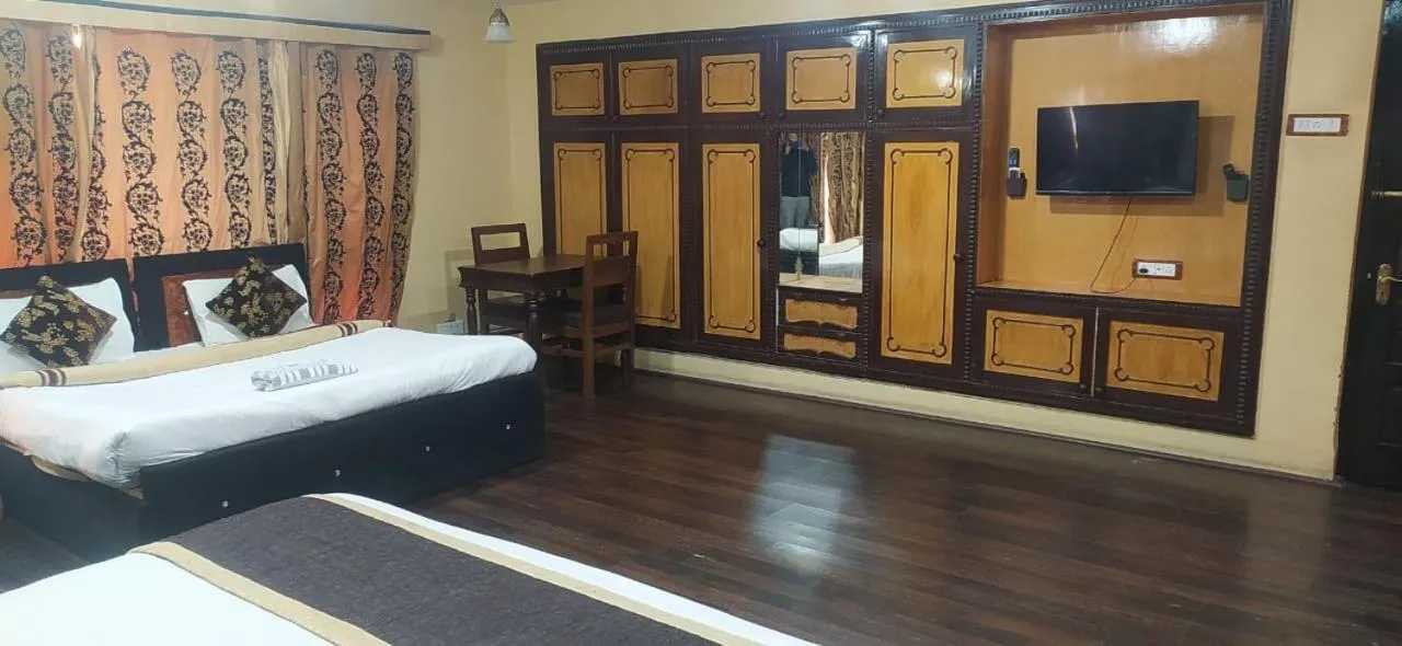 Bed in Heavenwood Heritage Hotel By Urban Inn Resorts