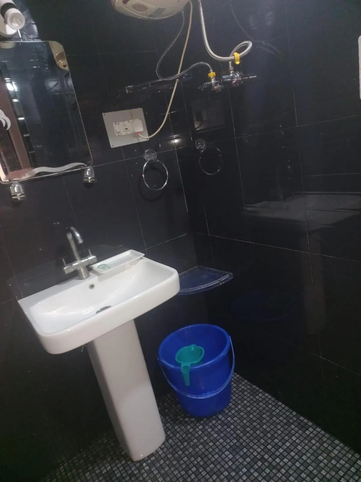 Bathroom in Heavenwood Heritage Hotel By Urban Inn Resorts