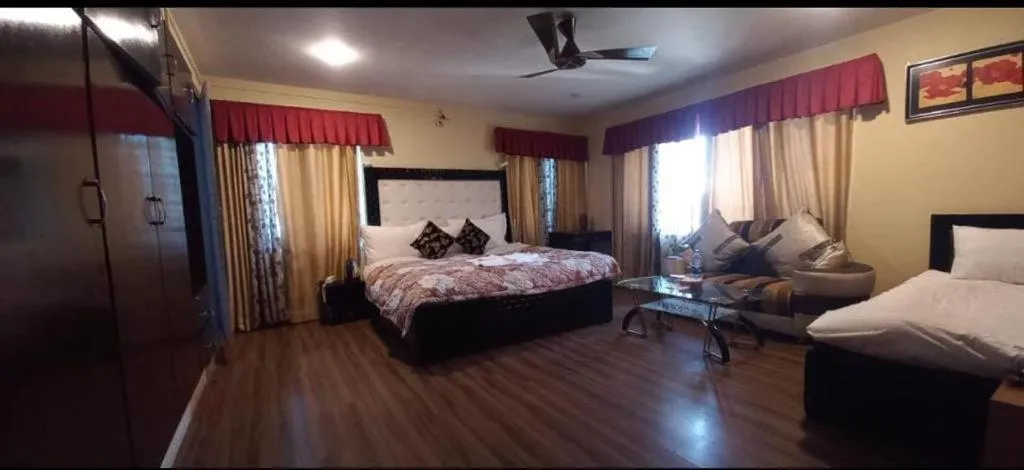 Bed in Heavenwood Heritage Hotel By Urban Inn Resorts