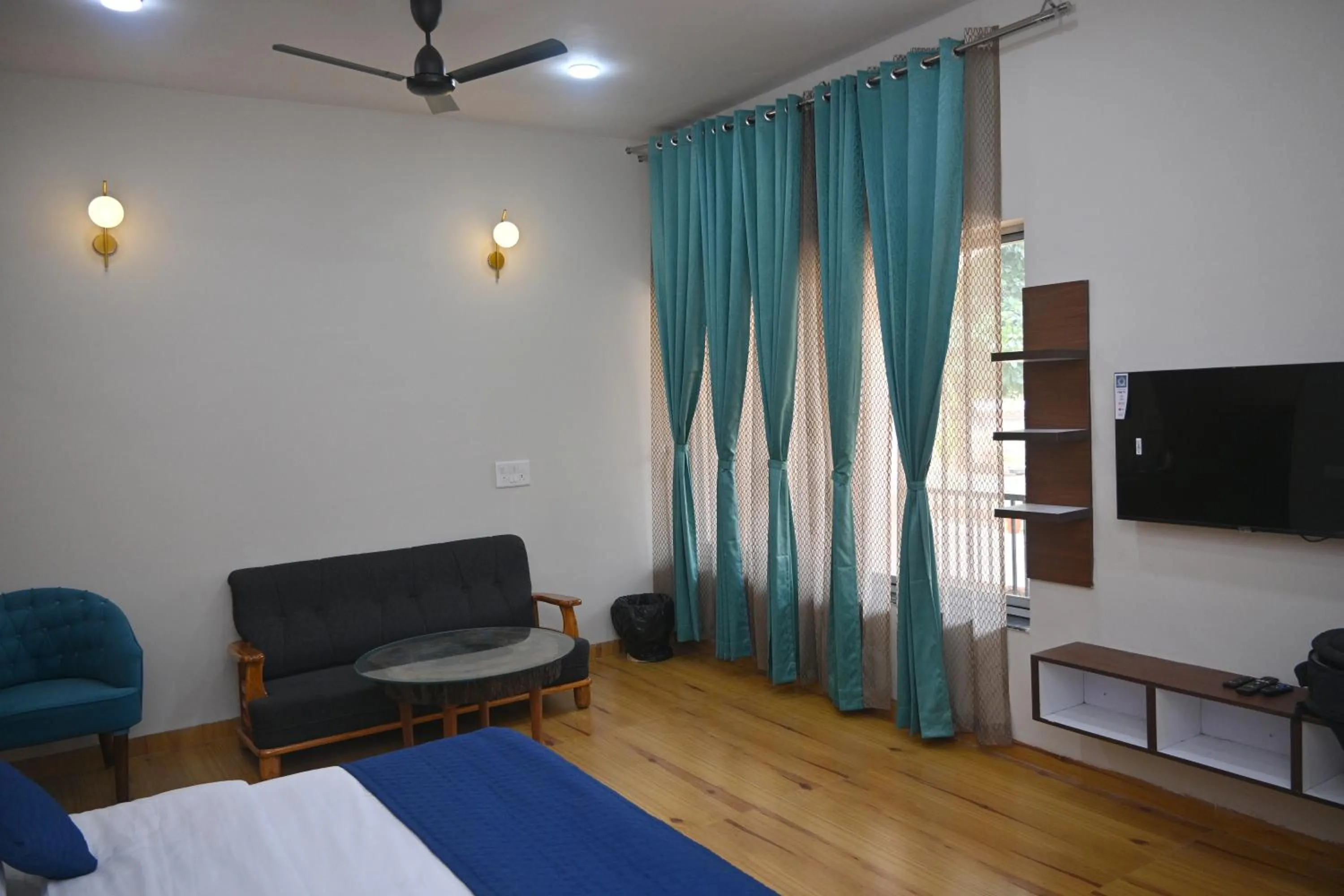 Seating area, Bed in Bandhavgarh Tiger Resort
