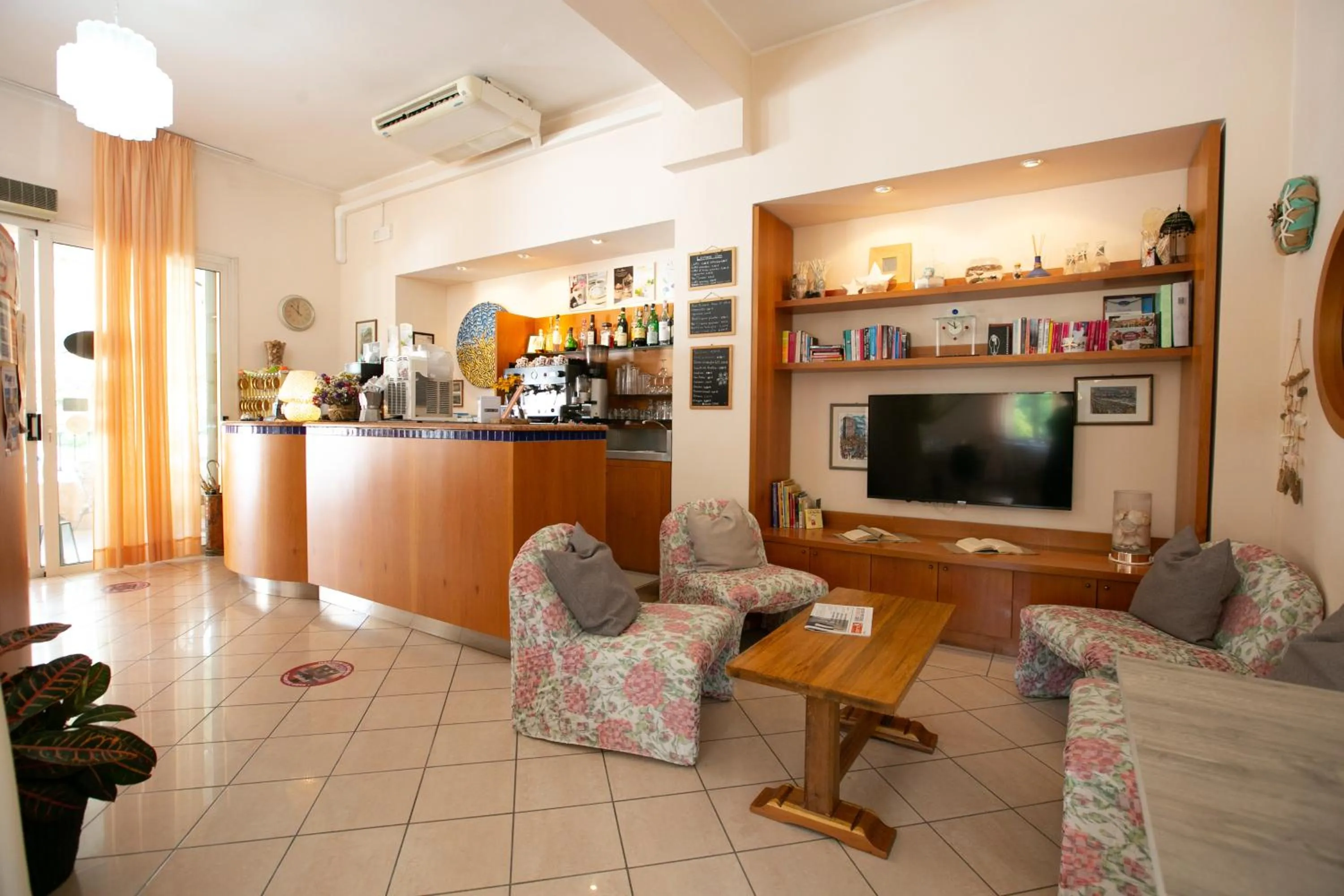Communal lounge/ TV room in Villa Gioiosa Beach & Water Park B&B