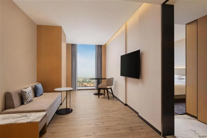 Seating area, Bed in Courtyard by Marriott Ranchi