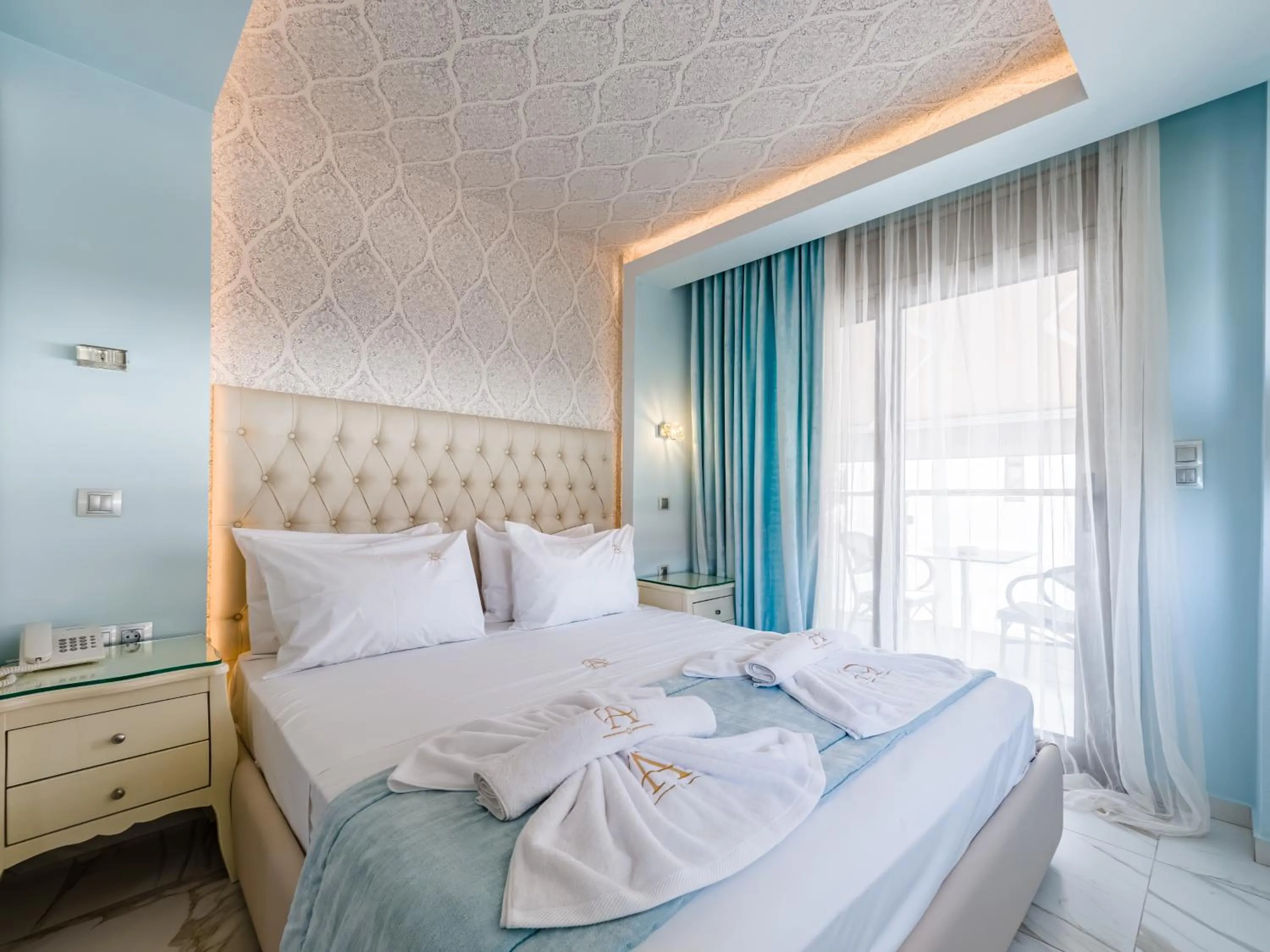 Bed in Alpha Luxury Suites